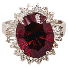 14K White Gold and Diamond Ring with Portuguese Cut Oval Garnet Center