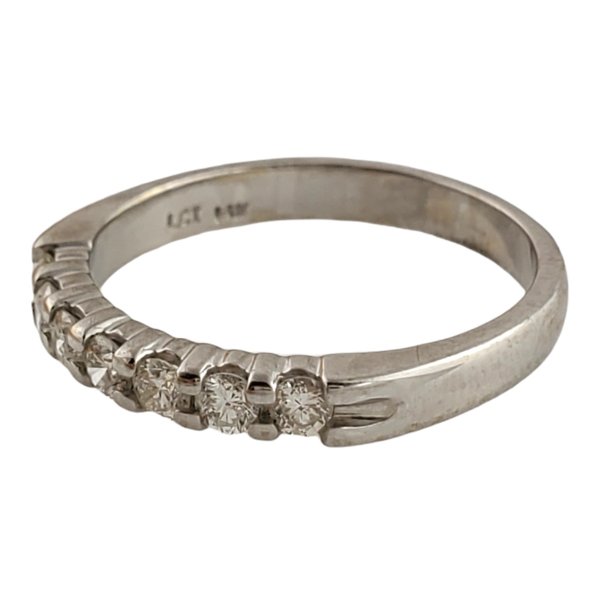 This band is set with 7 round brilliant diamonds.

Diamonds total approximately .28 carats total.

Clarity: SI - I1 clarity

Color:  J color

Shank is approximately 2.5 mm wide.

Hallmarked 14K LCI

2.2 g / 1.4 dwt

This ring is in very good pre