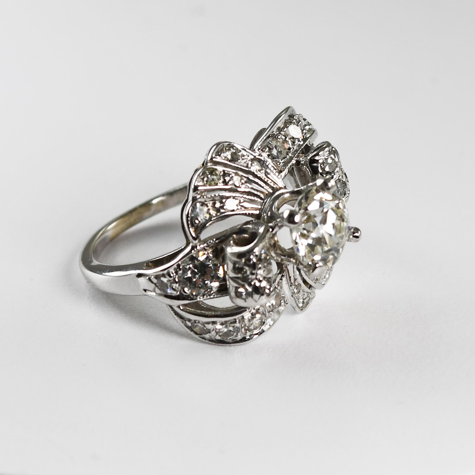 Ladies vintage diamond watch with 14k white gold mounting.
Stamped 14k and weighs 4.4 grams gross weight.
The center diamond is a 1.12 ct old-Euro cut, GIA graded i color, Vs1 clarity.
GIA report number is 6237509522.
On the sides of the ring are