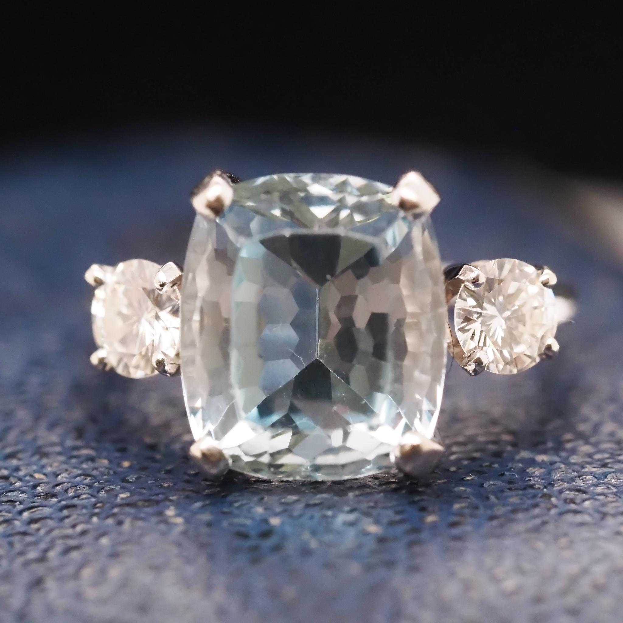 Year: 1940s
Item Details:
Ring Size: 7.25 (Sizable)
Metal Type: 14K White Gold [Hallmarked, and Tested]
Weight: 4.8grams
Aquamarine Details: 5.00ct, Blue, Cushion Cut
Diamond Details: .70ct total weight, Transitional Round, G color, VS Clarity
Band