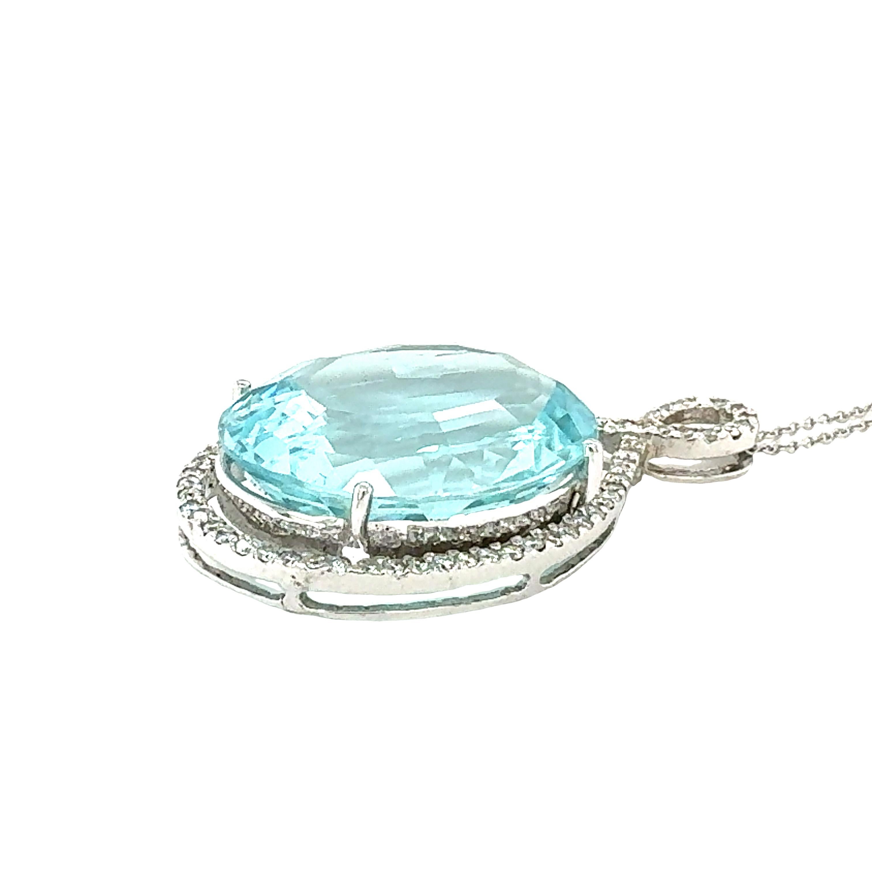 One aquamarine and diamond pendant in 14K white gold centering one prong set, oval brilliant cut aqua weighing approximately 48 ct.  Enhanced by 64 pave set, round brilliant cut diamonds weighing approximately 0.34 ct. with H-I color and SI-1