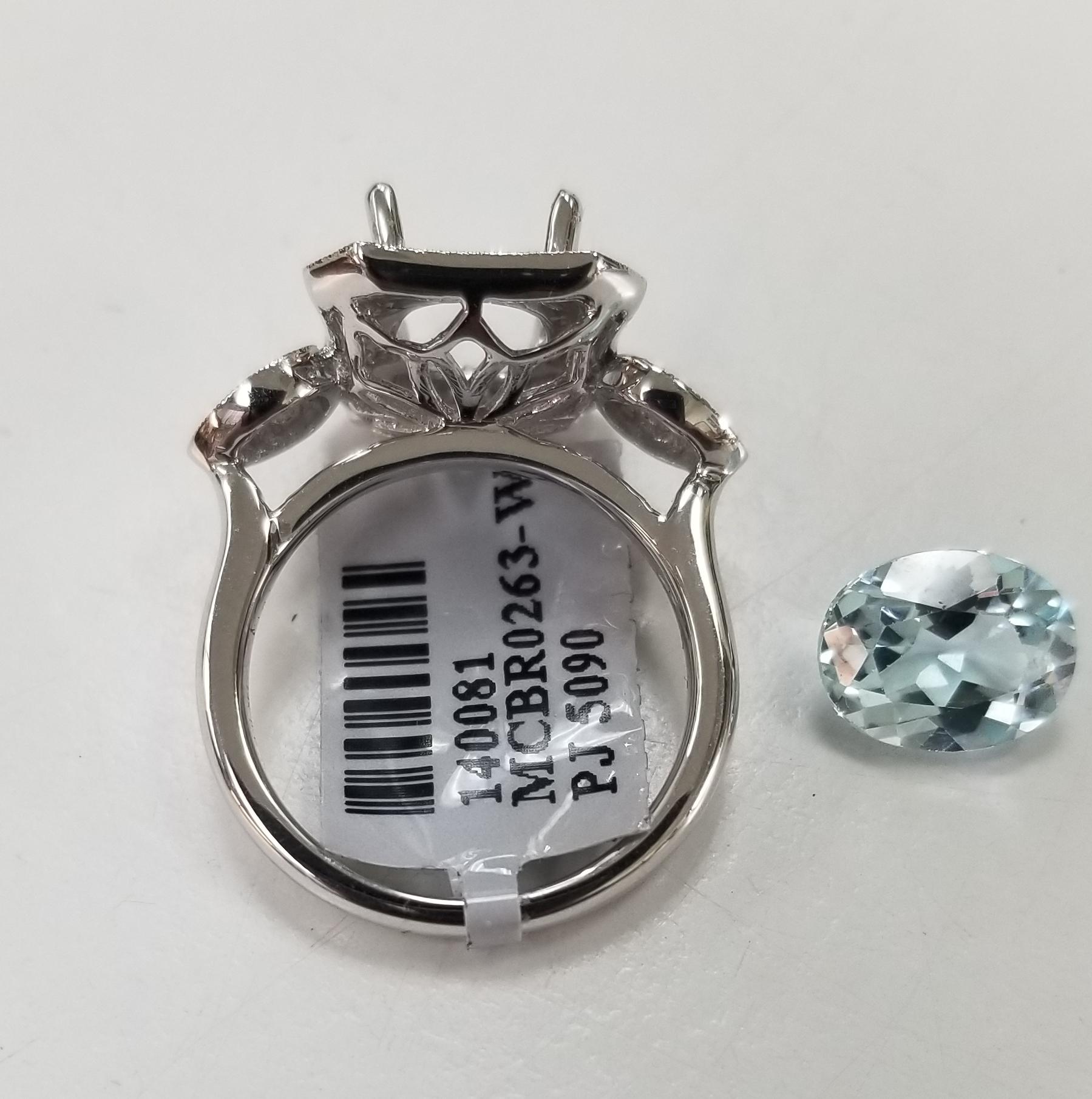 Oval Cut 14 Karat White Gold Aquamarine and Diamond Ring