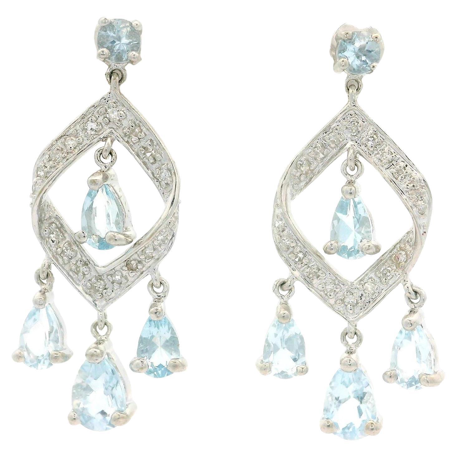 Orecchini pendenti con diamante e acquamarina in oro bianco 14k