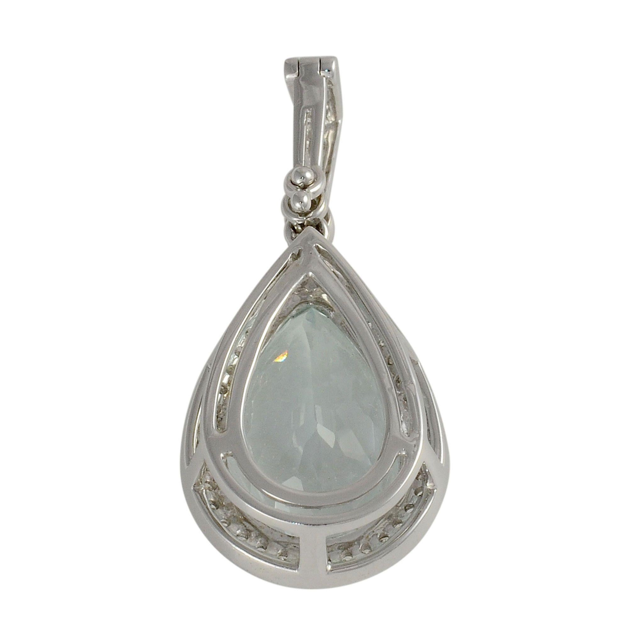 Estate 14K white gold aquamarine pendant enhancer featuring a pear cut aquamarine measuring 17mm x 11.4mm at approximately 8.38 carats. This aquamarine pendant is accented with approximately .43 CTW of diamonds. This aquamarine and diamond pendant