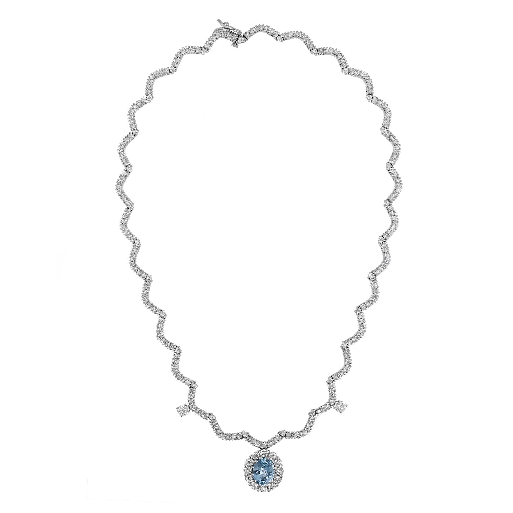 This necklace is made in 14K white gold and features an oval cut, 2.58 carat aquamarine. Surrounded by a halo and scalloped style necklace of 238 round cut. Diamonds weighing 8.20 carats combined.  Necklace has a color grade (H). and clarity grade