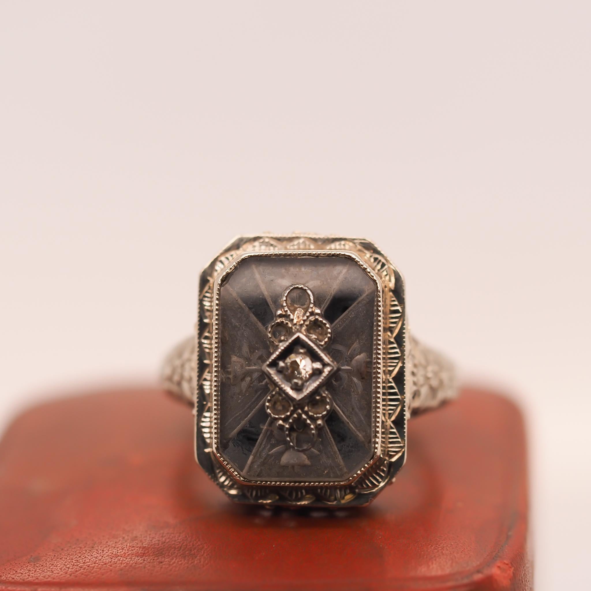 Year: 1930s
Item Details:
Ring Size: 5.75 (Sizable)
Metal Type: 14k White Gold [Hallmarked, and Tested]
Weight: 4.5 grams
Diamond Details: Antique Single Cut, .03ct, F Color, VS Clarity
Band Width: 2.5mm
Condition: Excellent
Art Deco