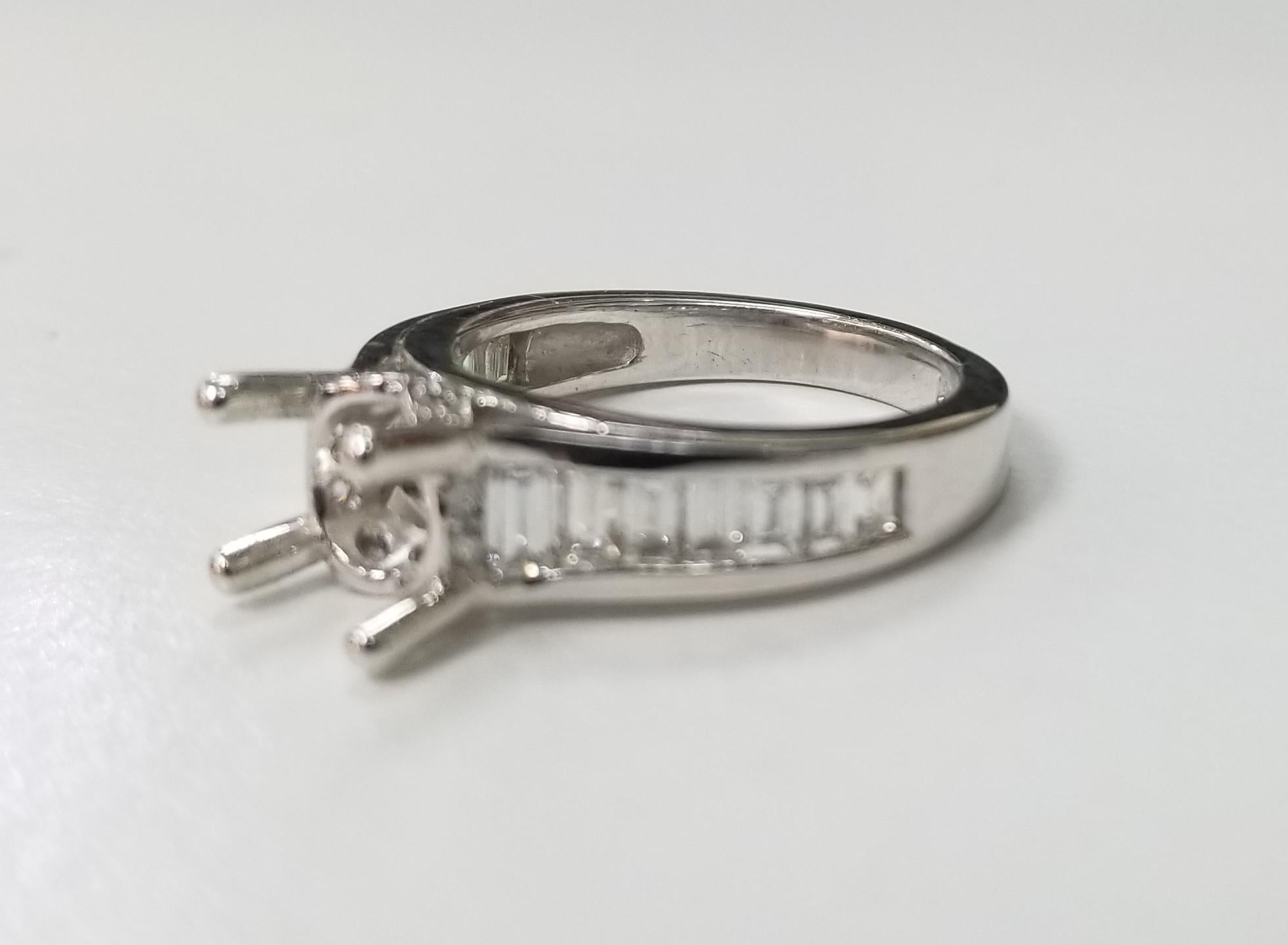 14k white gold baguette and round ascent diamond ring, containing 14 baguette cut diamonds weighing 1.00ct. and 10 round full cut diamonds weighing .11pts., color 