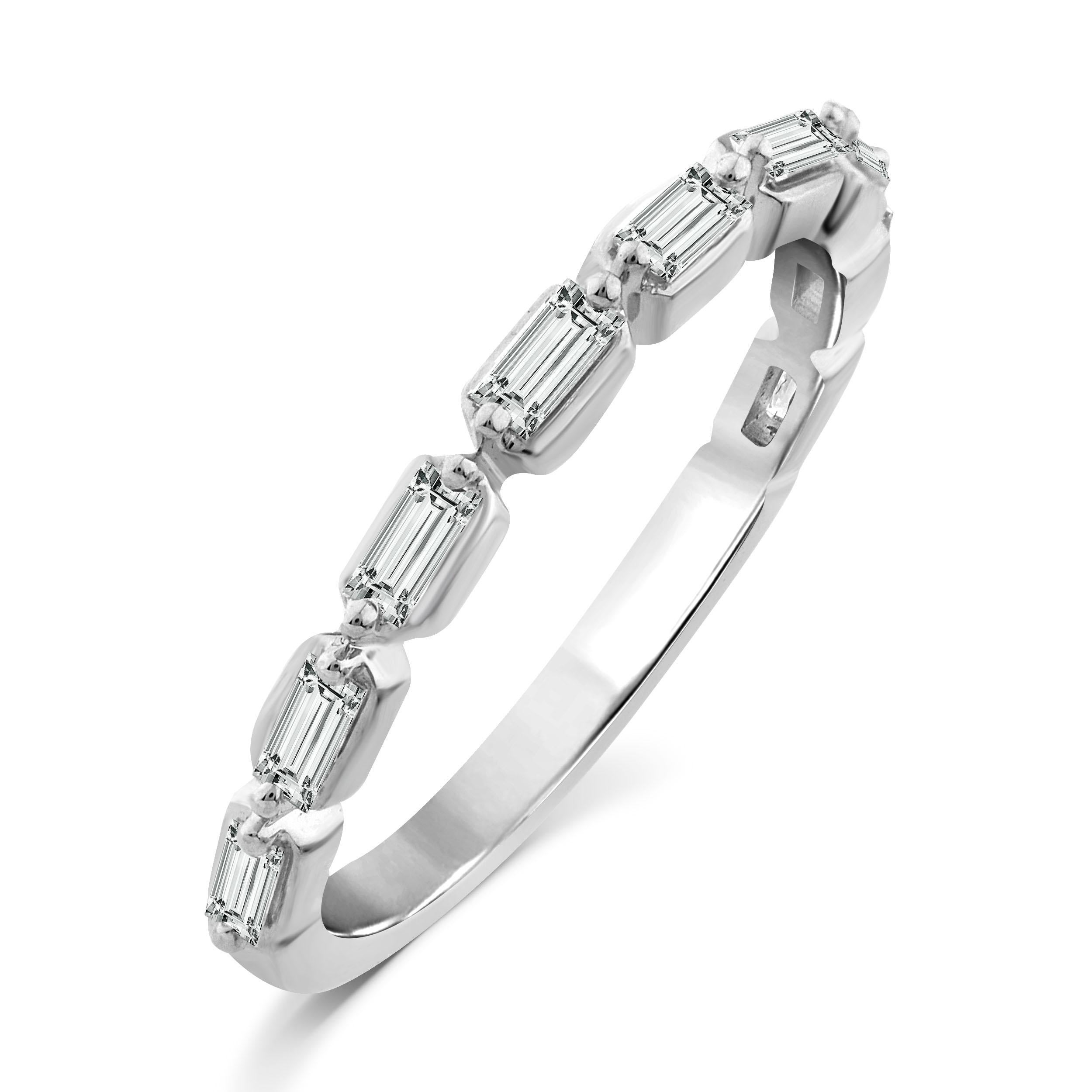 The Floating Baguette Diamond Band Ring is our take on classic diamond engagement bands with a modern twist. This semi eternity diamond band ring features horizontal baguettes set with spaces in between to create a floating look. This 14K white gold