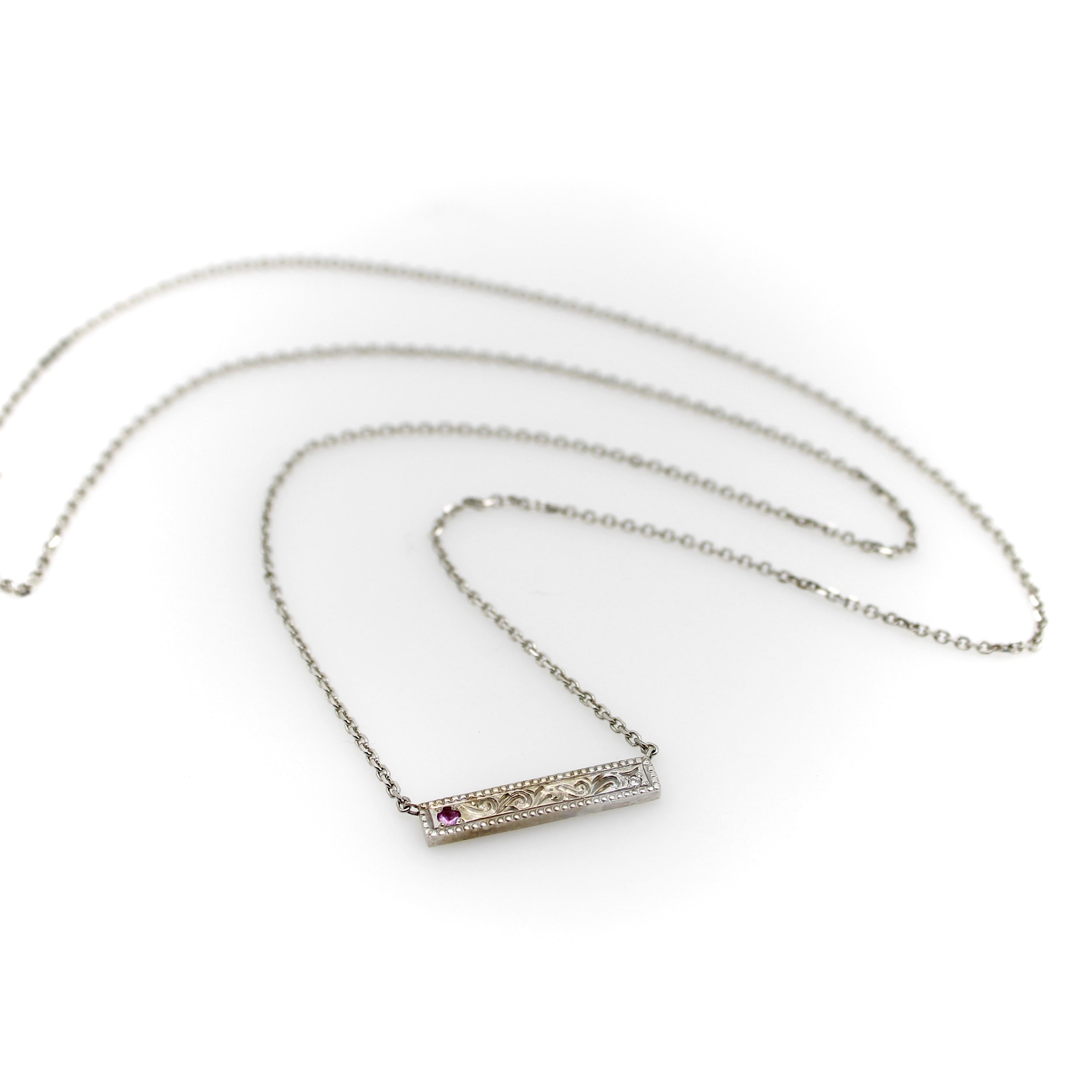 This one-of-a-kind 14k white gold necklace was handmade by Master Jeweler Michael von Krenner. A simple bar of white gold was used as a palate to hand-engrave with traditional scrolling foliate and a beautiful milgrain border. One end of the bar