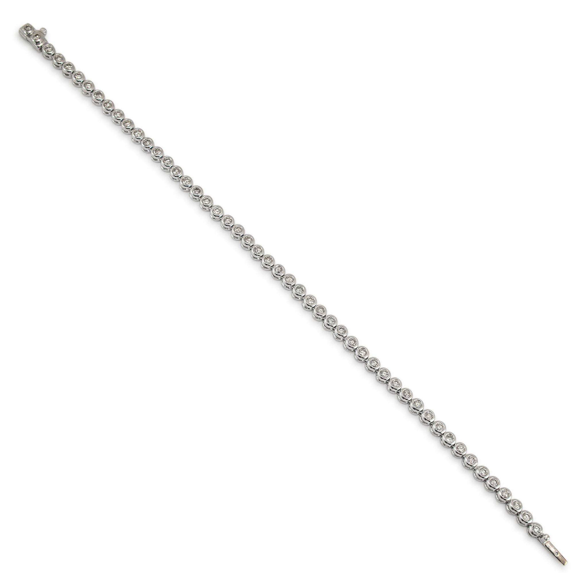 Gender: Unisex

Metal Type: 14K White Gold

Length: 7.25 inches

Width: 3.50 mm

Weight: 9.50 grams

14K White Gold diamond tennis bracelet. The metal was tested and determined to be 14K white gold. Engraved with 