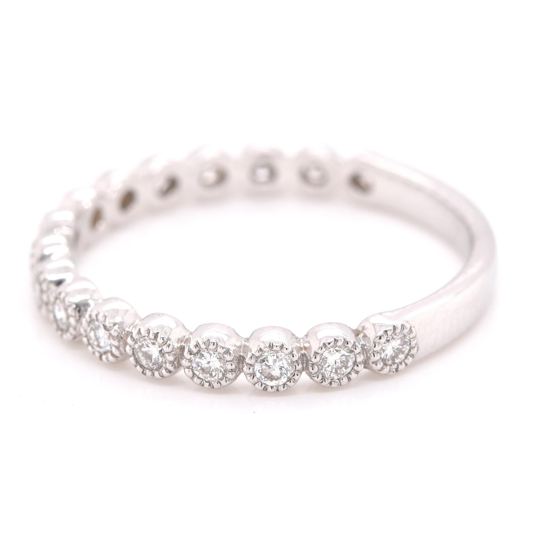 Material: 14k white gold
Diamonds: 17 round brilliant cuts = 0.31cttw
Color: G-H
Clarity: VS
Size: 6 ½ 
Dimensions: ring is 2.25mm wide
Weight: 1.70 grams
