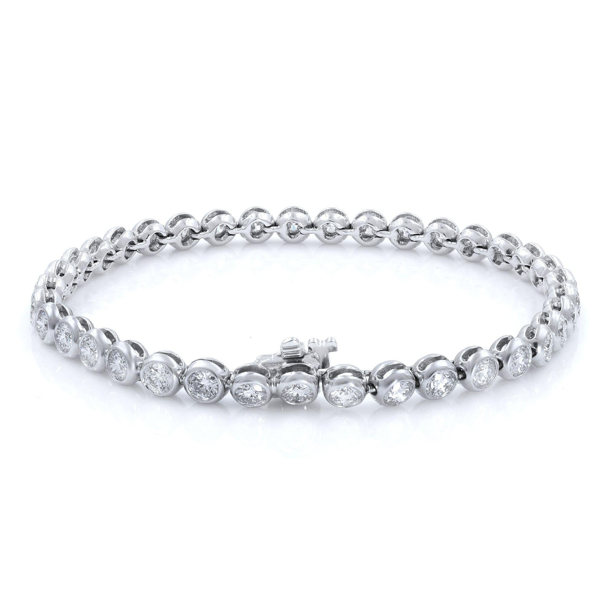An elegant 14k white gold tennis bracelet featuring 37 round diamonds in a bezel setting. Total diamond weight is 5.50 carats where each diamond is 3.0mm. Diamond possesses color and clarity of H-I and VS-SI. All diamonds are perfectly matched to