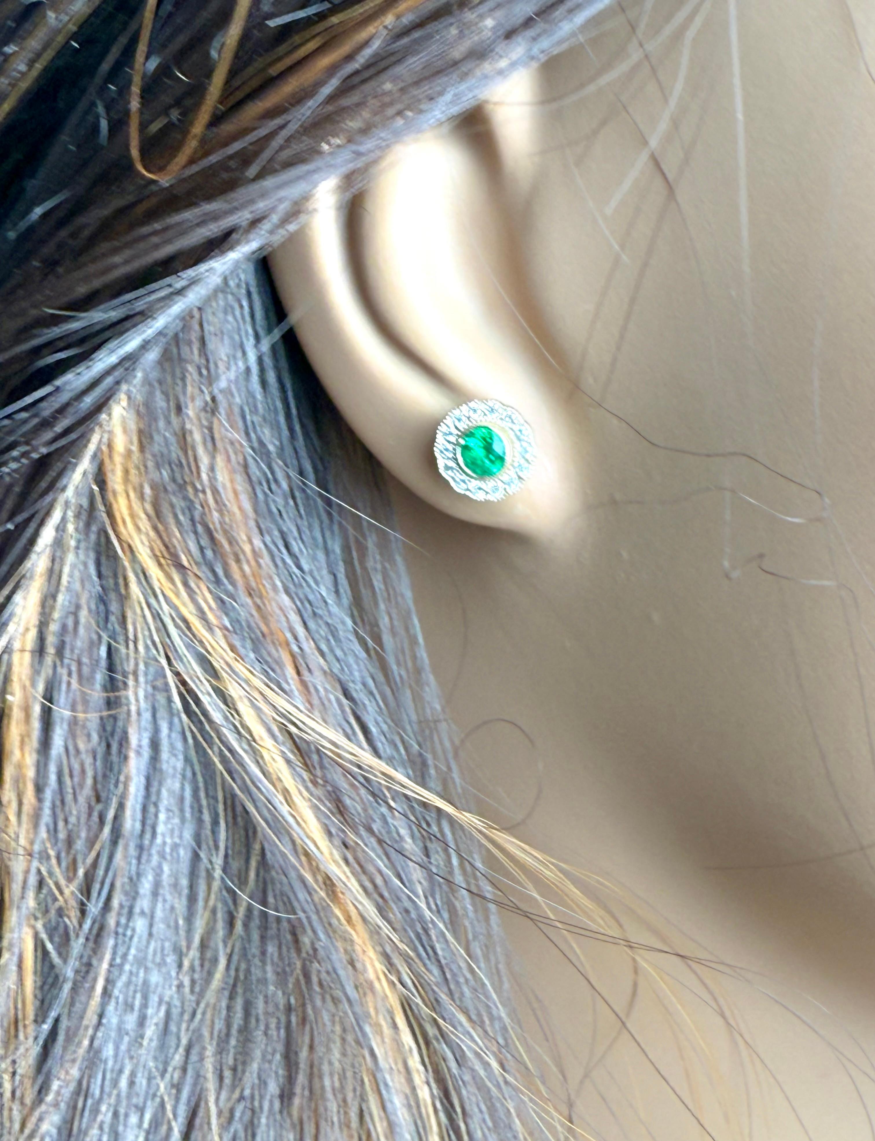 Modern 14K White Gold Bezel Set Emerald and Diamond Millgrain Halo Stud Earrings For Sale