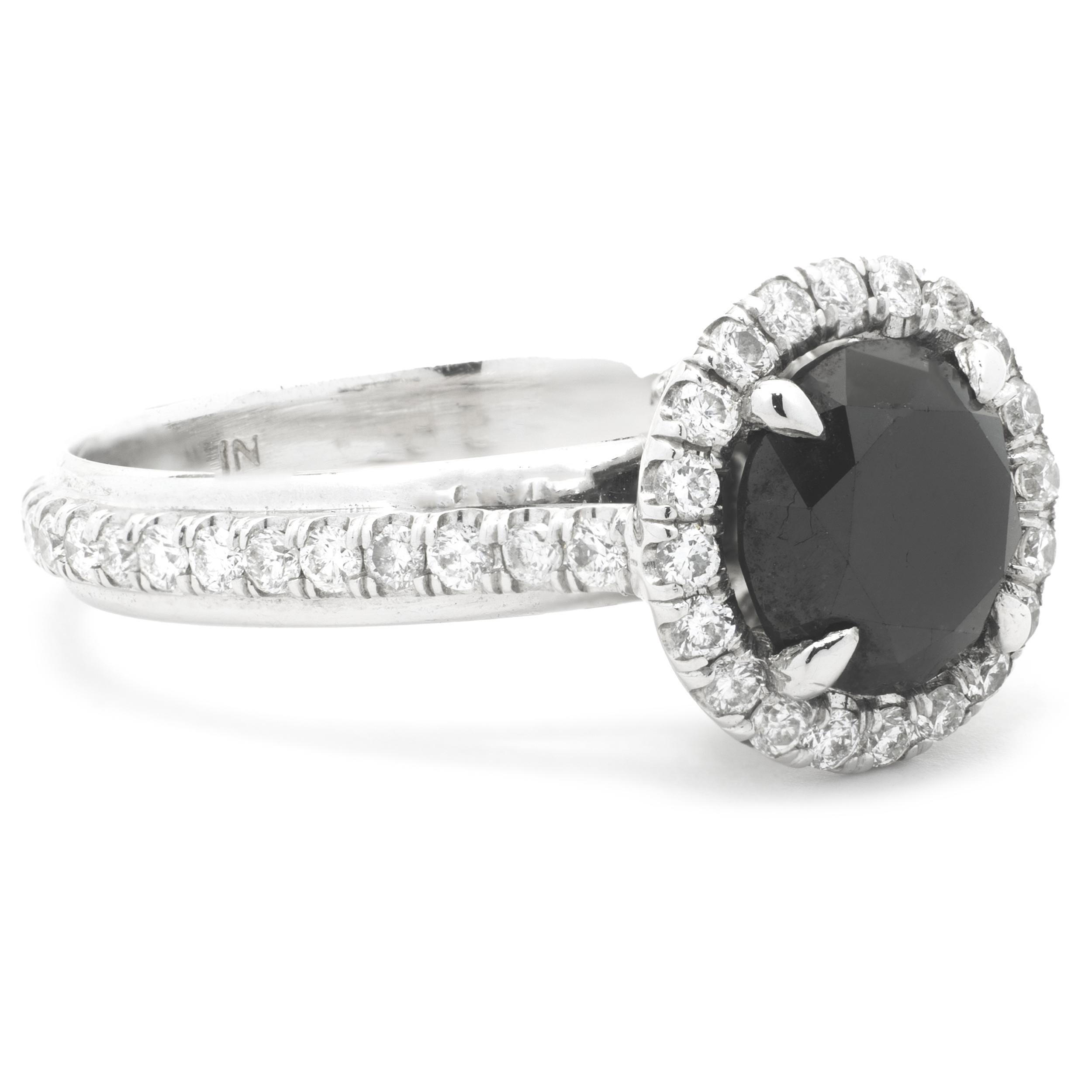Material: 14k white gold
Center Diamond: 1 round cut = 1.88ct
Color: black
Accent Diamonds: 64 round brilliant cuts = 1.25cttw
Color: H
Clarity: SI2
Ring Size: 7 (please allow up to 2 additional business days for sizing requests)
Dimensions: ring