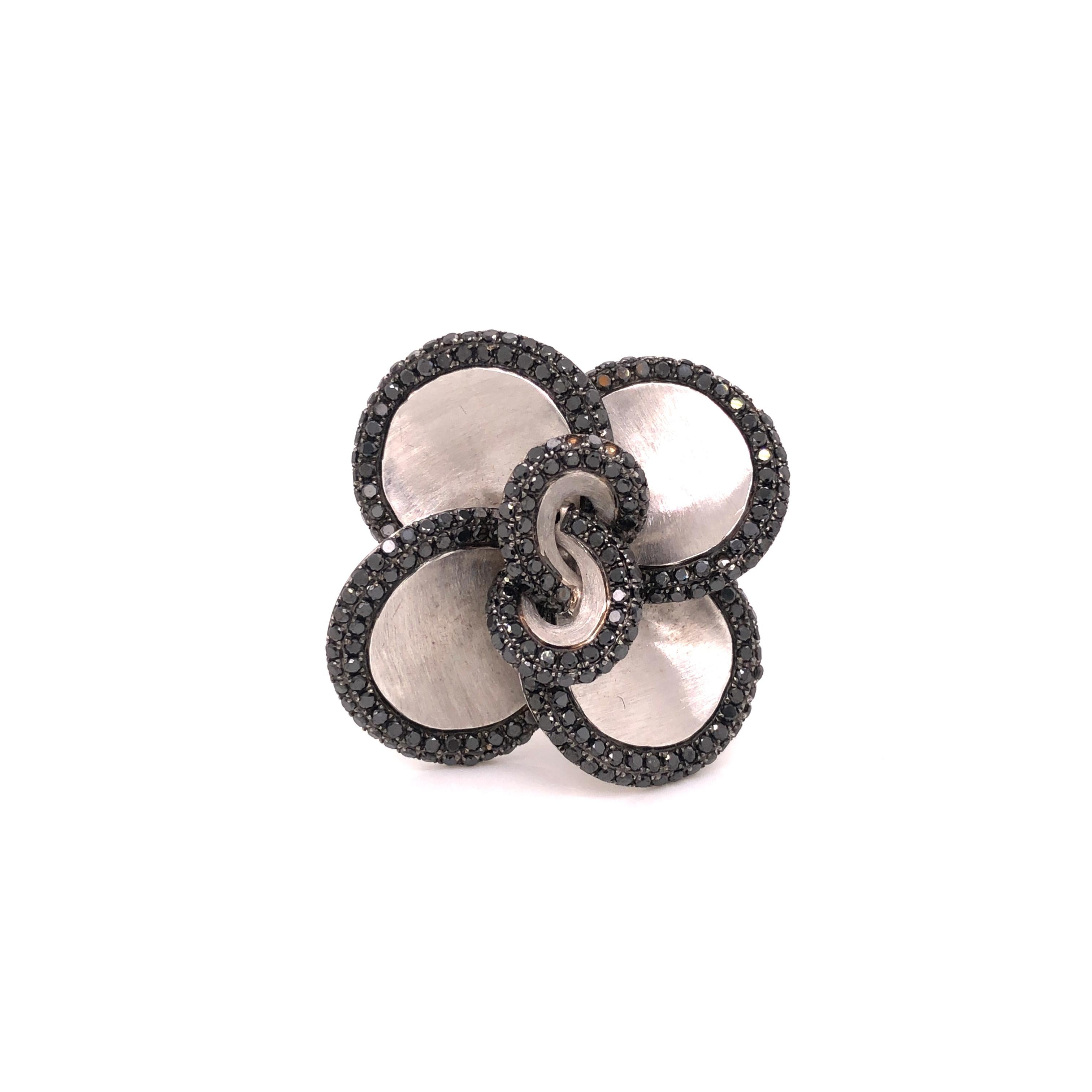 A beautiful floral cocktail ring contains round-cut black diamonds weighing a total of approximately 2.51 carats, set in 14K white gold.

Ring size 7

