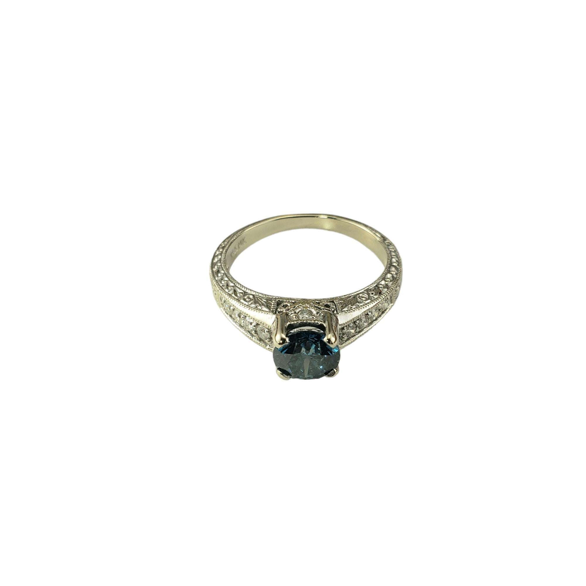 14 Karat White Gold Irradiated Blue and White Diamond Ring Size 6.75 JAGi Certified-

This lovely ring features one round color treated blue round brilliant cut diamond (6.4 mm) and ten round brilliant cut white diamonds set in beautifully detailed