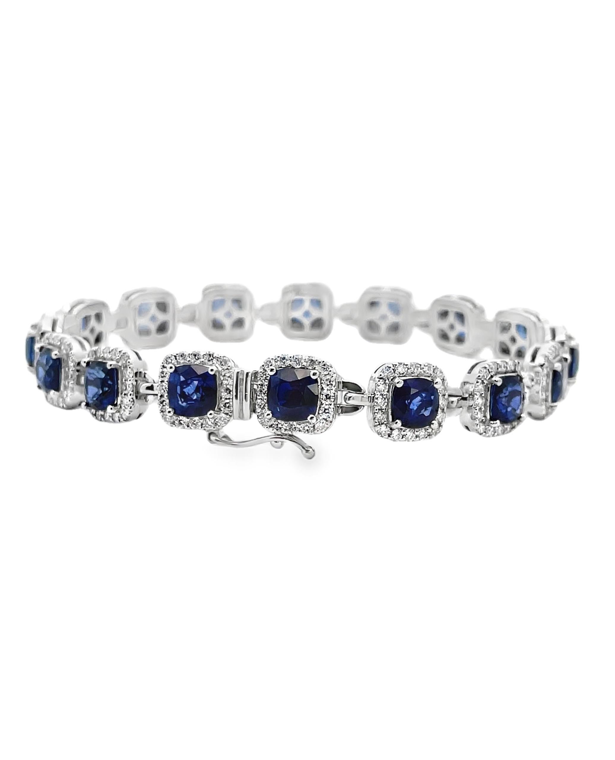 14K white gold bracelet with 16 cushion cut blue sapphires weighing 11.03 carats total and 256 diamonds weighing 2.65 carats total. 

- Bracelet is 7 inches long