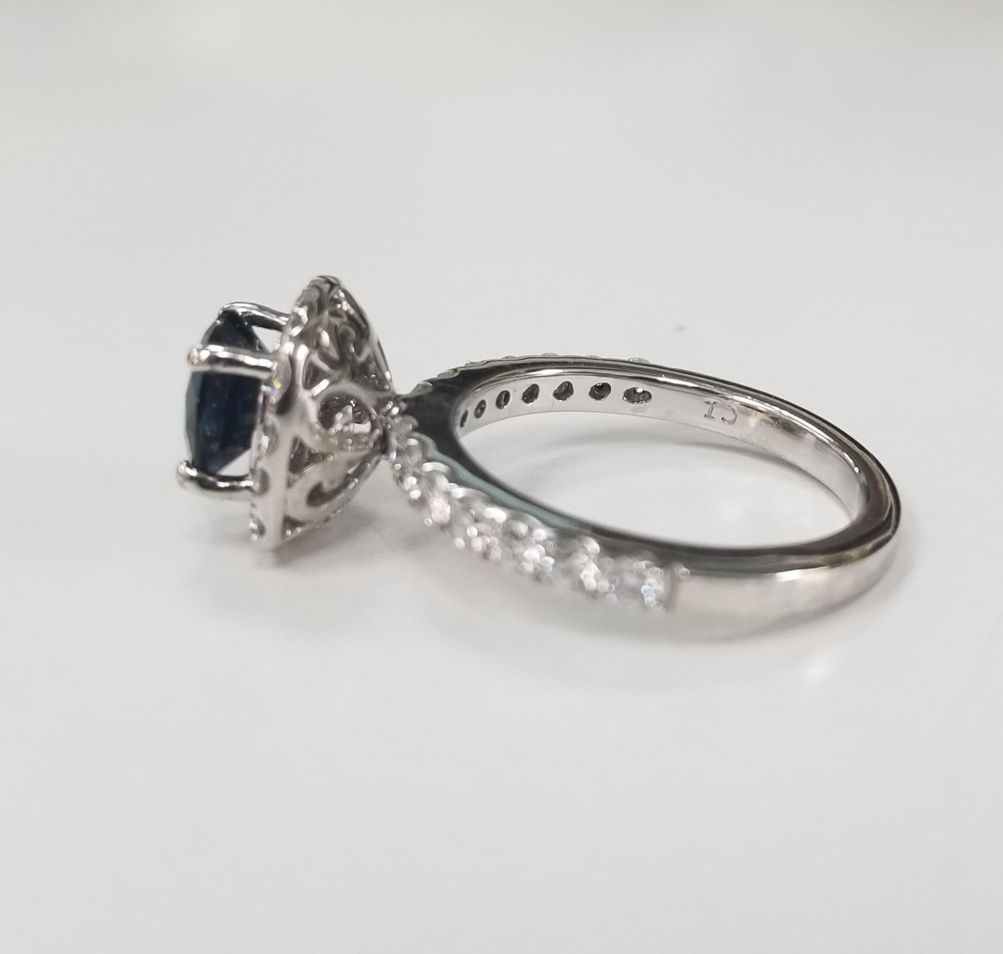 Contemporary 14 Karat White Gold Blue Sapphire and Diamond Halo Ring
