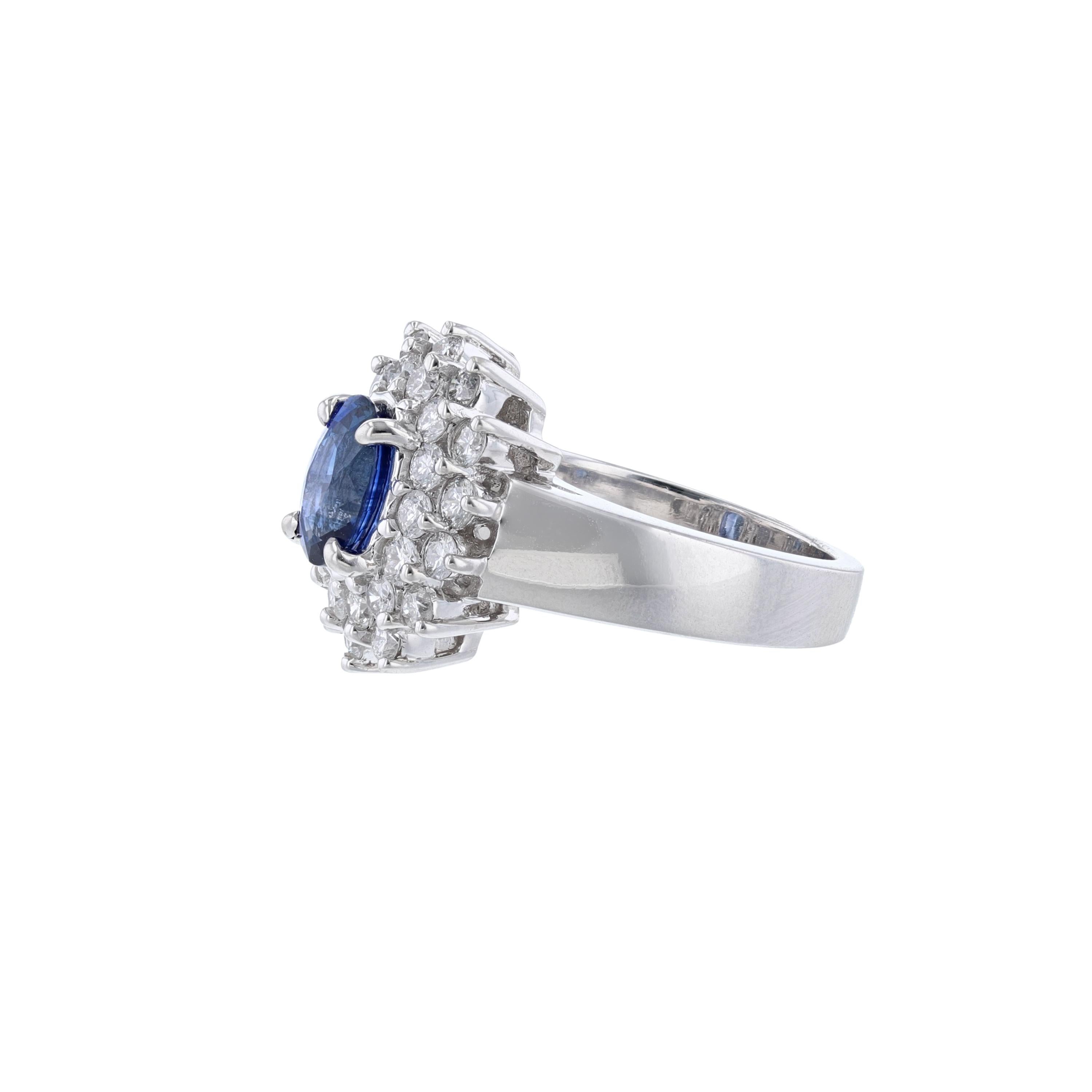 This ring is in 14K white gold. It features 1 oval-cut blue sapphire weighing 1.60. It also features 28 round cut diamonds weighing 1.14 carats. With a color grade (H) and clarity grade (SI2). All stones are prong set 