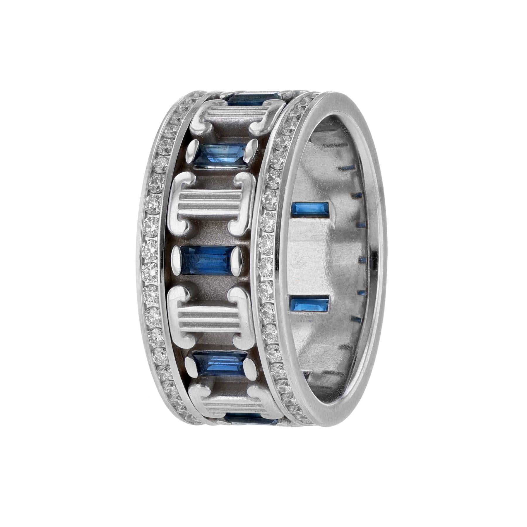 This ring is made in 14K white gold and features 9 emerald cut blue sapphires weighing 1.40 carats. It also features 2 rows of 92 round cut diamonds weighing 1.13 carats.  With a color grade (H) and clarity grade (VS). All stones are channel set.