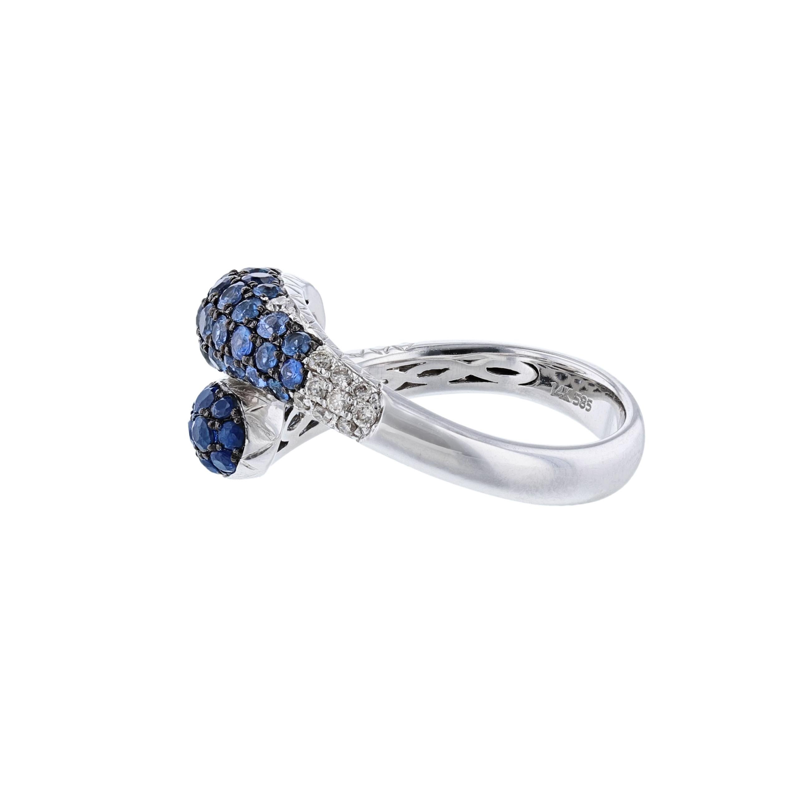 This ring is 14k white gold and features 52 blue sapphires weighing 1.52carats. Also includes 21 round cut diamonds weighing 0.18 carat. The ring has a a color grade (H) with a clarity grade of (SI2). All stones are pave' set 