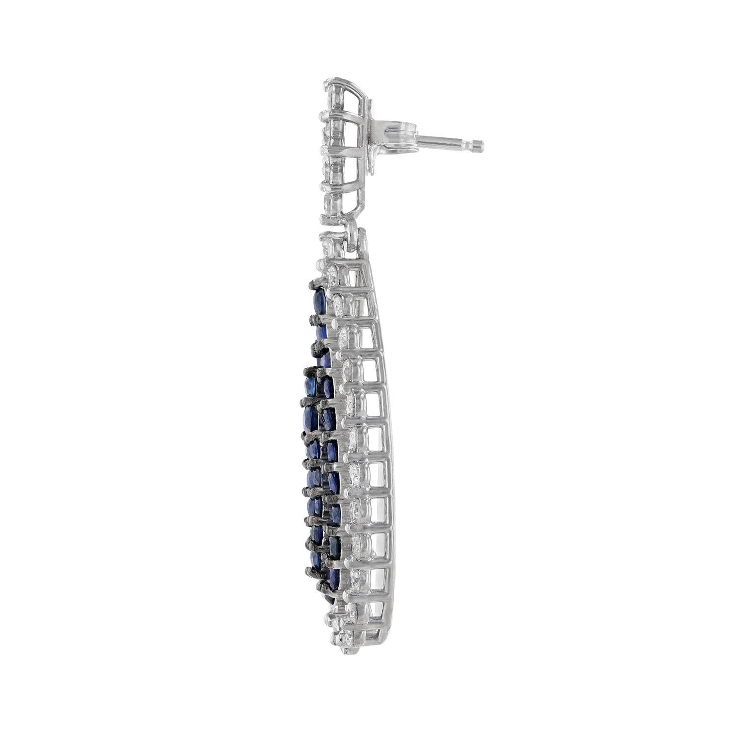 These teardrop shape earrings are made in 14K white gold and feature 60 blue sapphires weighing 2.30 carat. Along with 70 round diamonds weighing 2.06 carat. All stones are prong set. 

