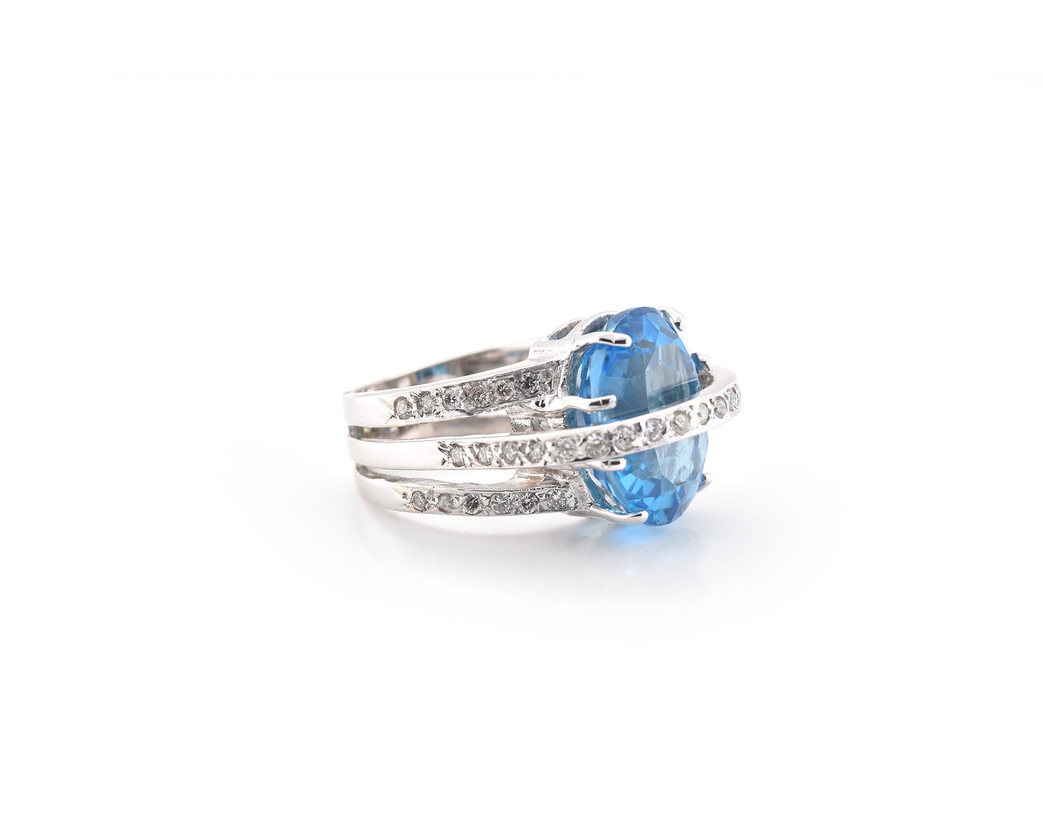 Designer: custom design
Material: 14k white gold
Blue Topaz: 1 oval faceted cut blue topaz = 9.50ct
Diamonds: 48 round brilliant cuts = 0.82cttw
Color: H-J
Clarity: SI2
Ring Size: 2 ¼ (please allow two additional shipping days for sizing