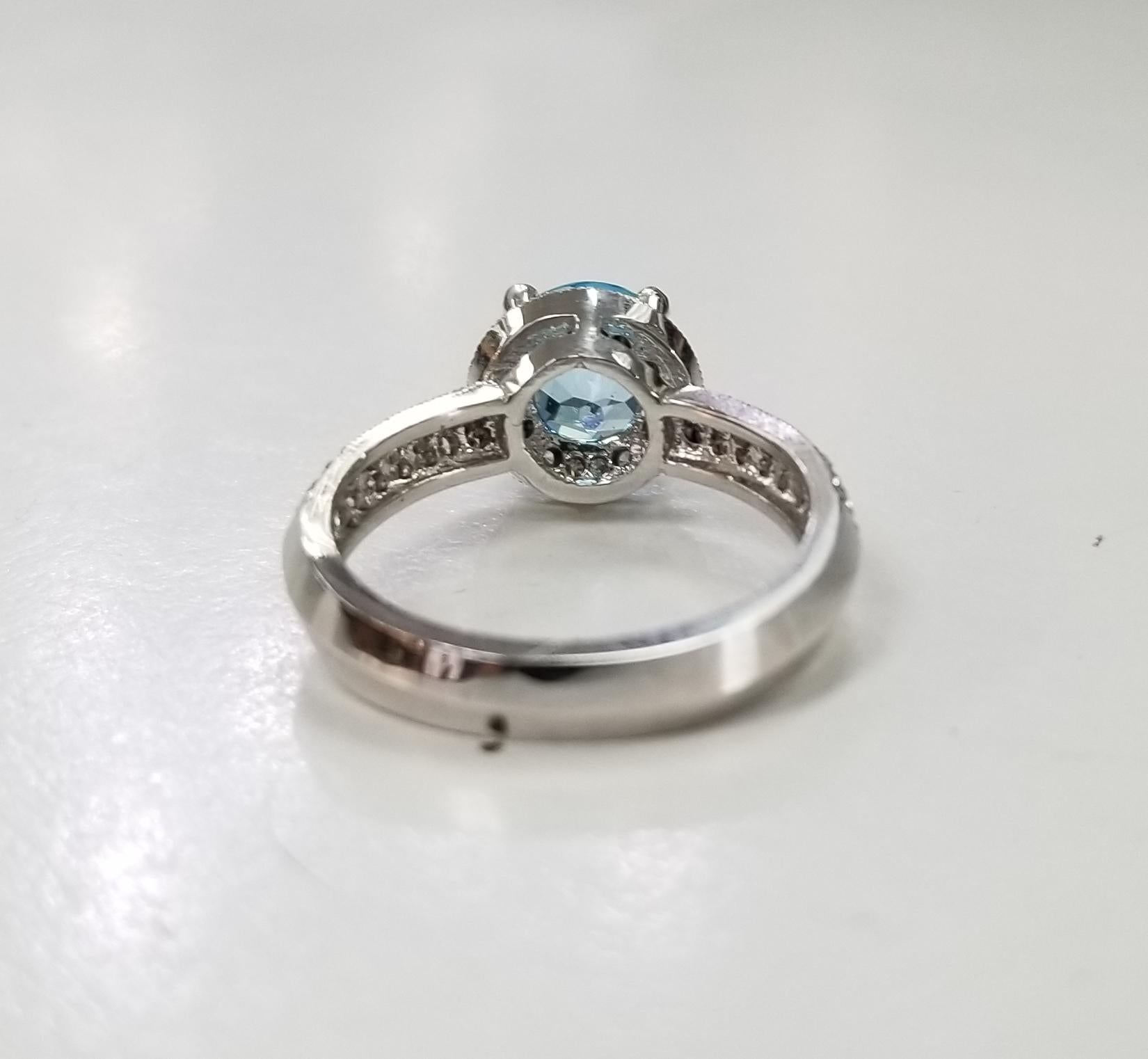 Contemporary 14 Karat White Gold Blue Topaz and Diamond Ring Paved on Knife Edge For Sale