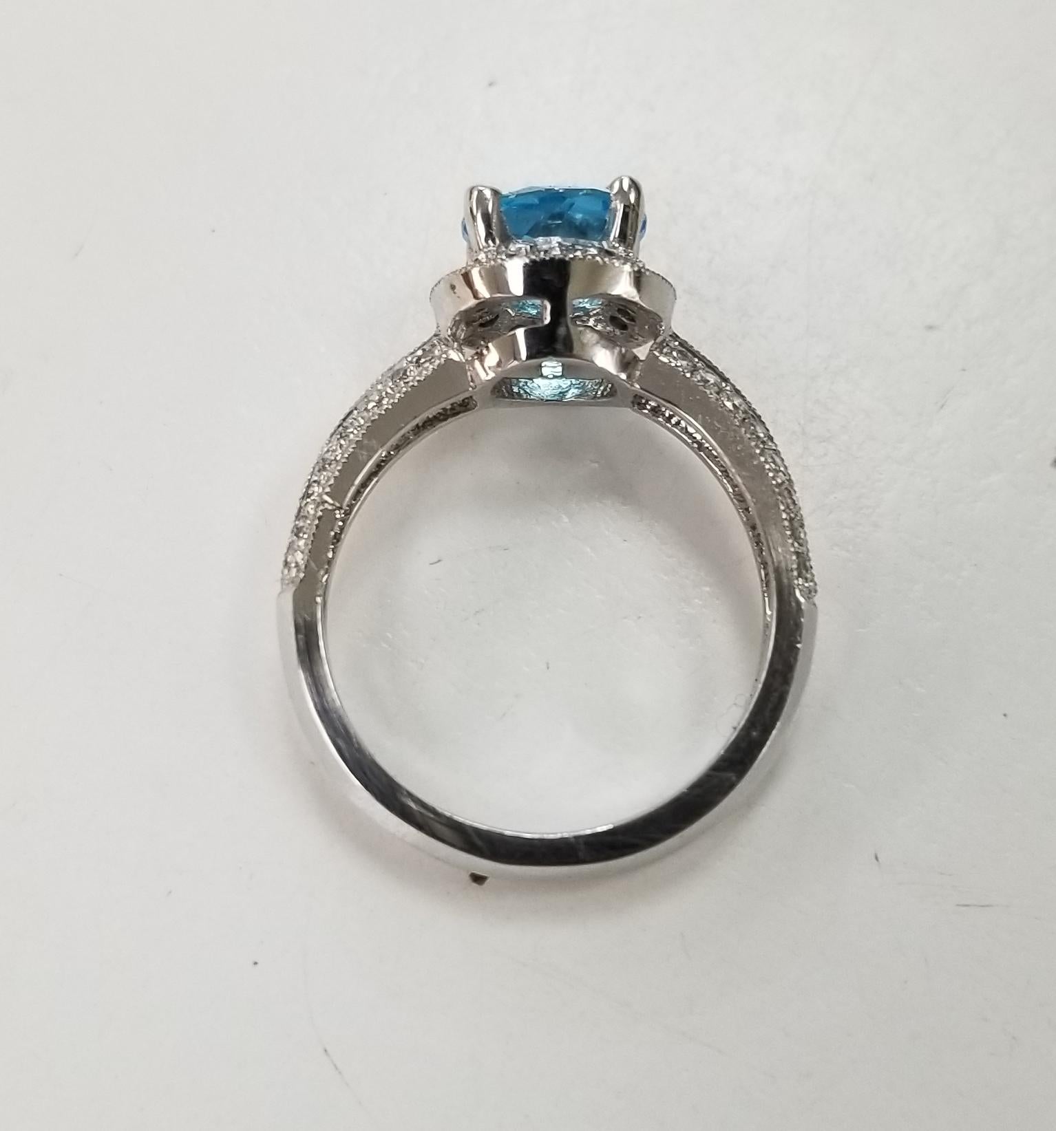 Round Cut 14 Karat White Gold Blue Topaz and Diamond Ring Paved on Knife Edge For Sale