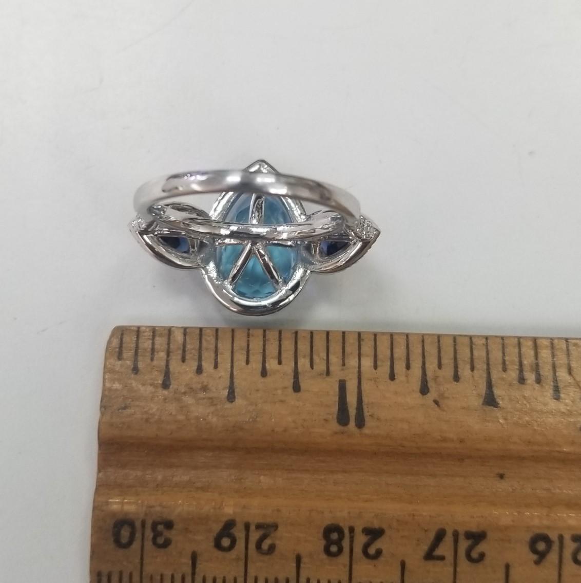  14k White Gold Blue Topaz, Blue Sapphire and diamond 3 stone halo ring In New Condition For Sale In Los Angeles, CA