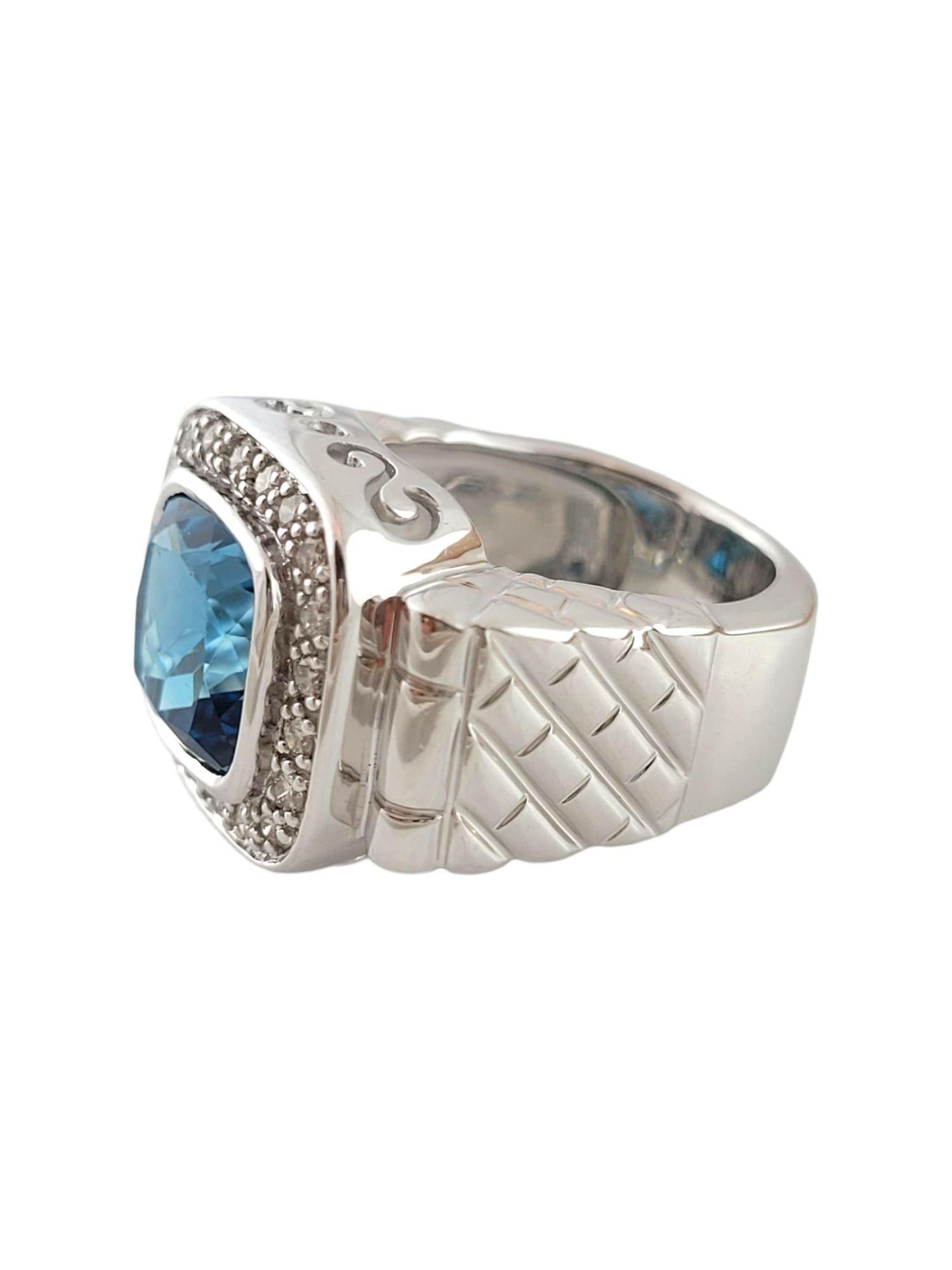 This gorgeous 14K gold cocktail ring features a beautiful, square cut blue topaz stone surrounded by 21 round cut, sparkling diamonds!

Approximate total diamond weight: .31 cttw

Diamond clarity: SI1-I1

Diamond color: J-K

5.88ct blue topaz. Eye
