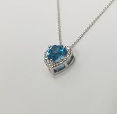 14k White Gold Blue Topaz Heart Shape with a Diamond Halo pendant