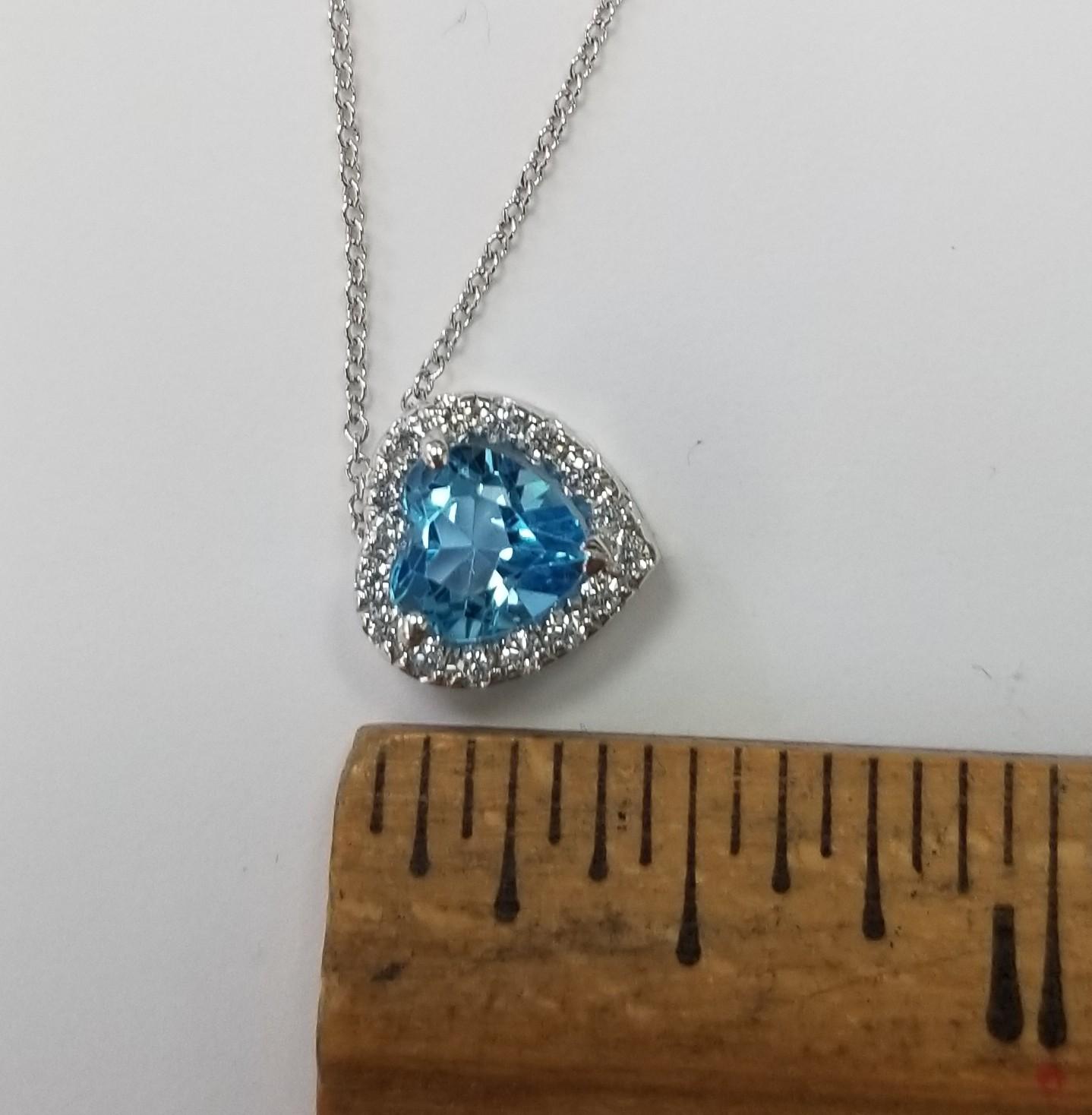 Heart Cut 14k White Gold Blue Topaz Heart Shape with a Diamond Halo pendant For Sale