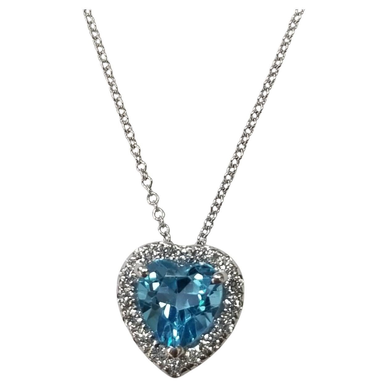 14k White Gold Blue Topaz Heart Shape with a Diamond Halo pendant For Sale