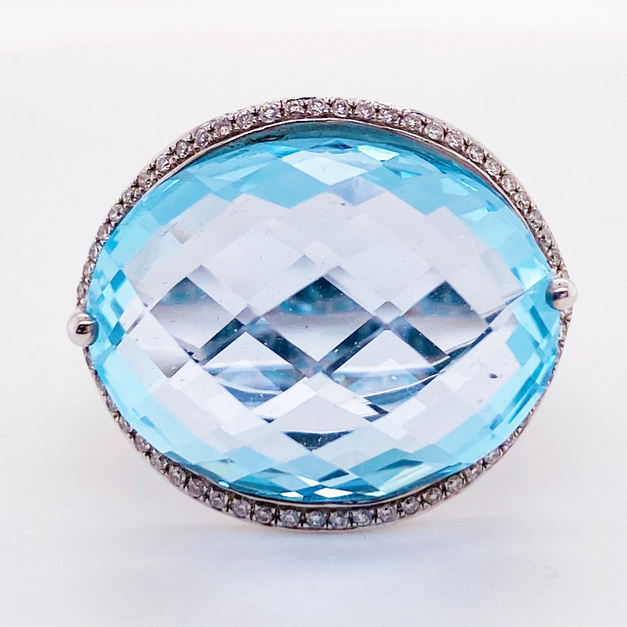 14 Karat White Gold
13.3 carat Blue Topaz
0.35 carat Diamond 
59 total diamonds 
Ring Size- 7.5 
