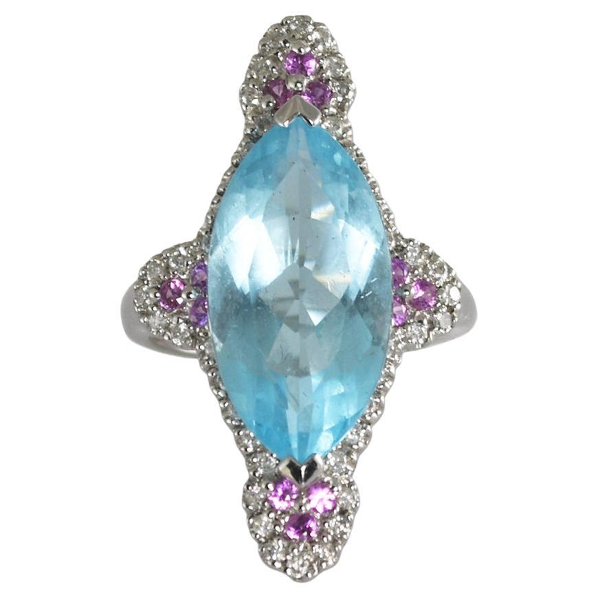 Anillo de oro blanco de 14 quilates con topacio azul, zafiro y diamantes