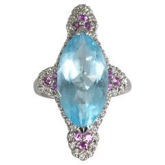 Anillo de oro blanco de 14 quilates con topacio azul, zafiro y diamantes
