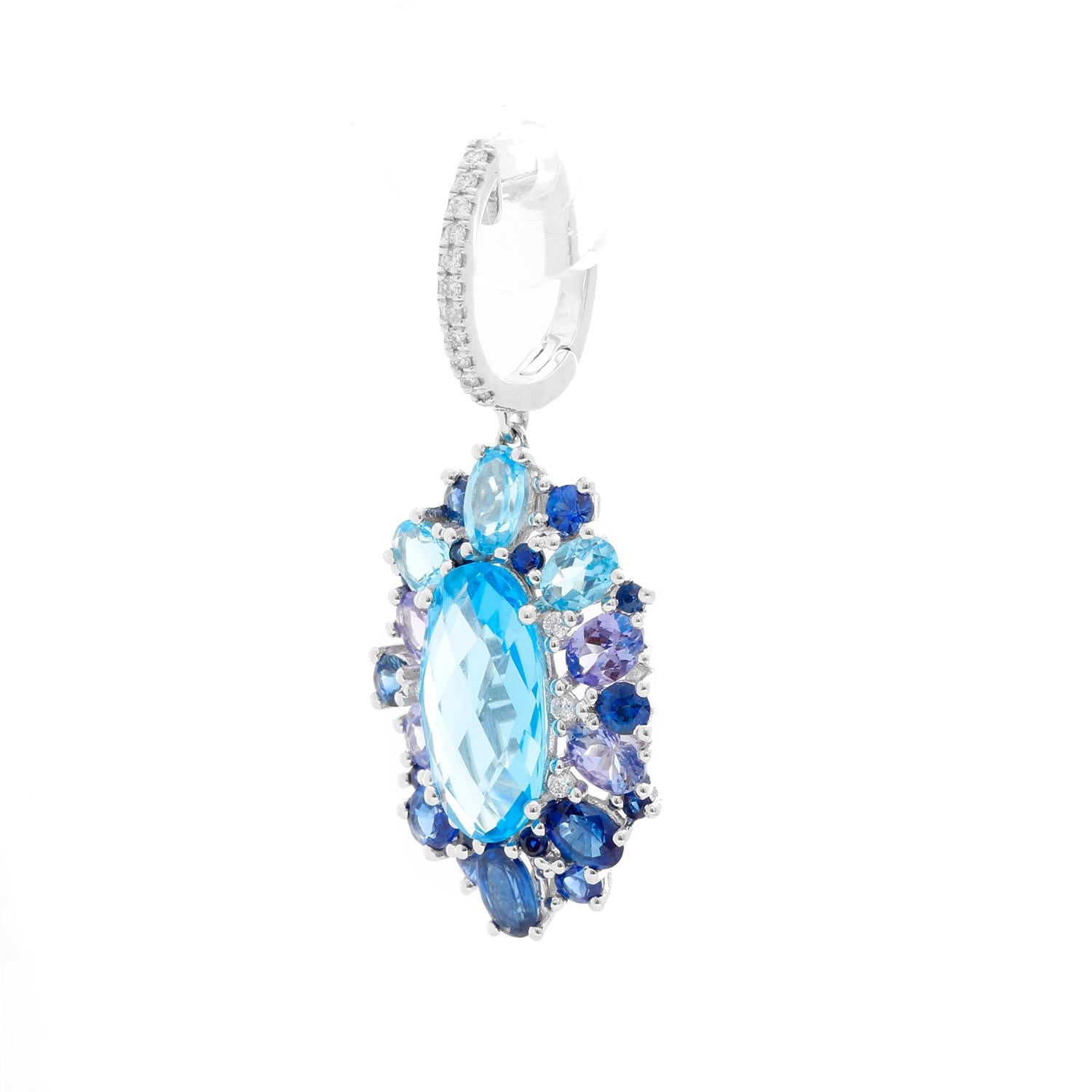 14K White gold Blue Topaz, Tanzanite, Sapphire &  Diamond Earrings  - Stunning flower design with a center of Blue Topaz weighing 5.98 cts. surrounded by Tanzanite, Sapphires and diamonds weighing 5.28 cts. on a diamond hoop weighing .21 cts. 