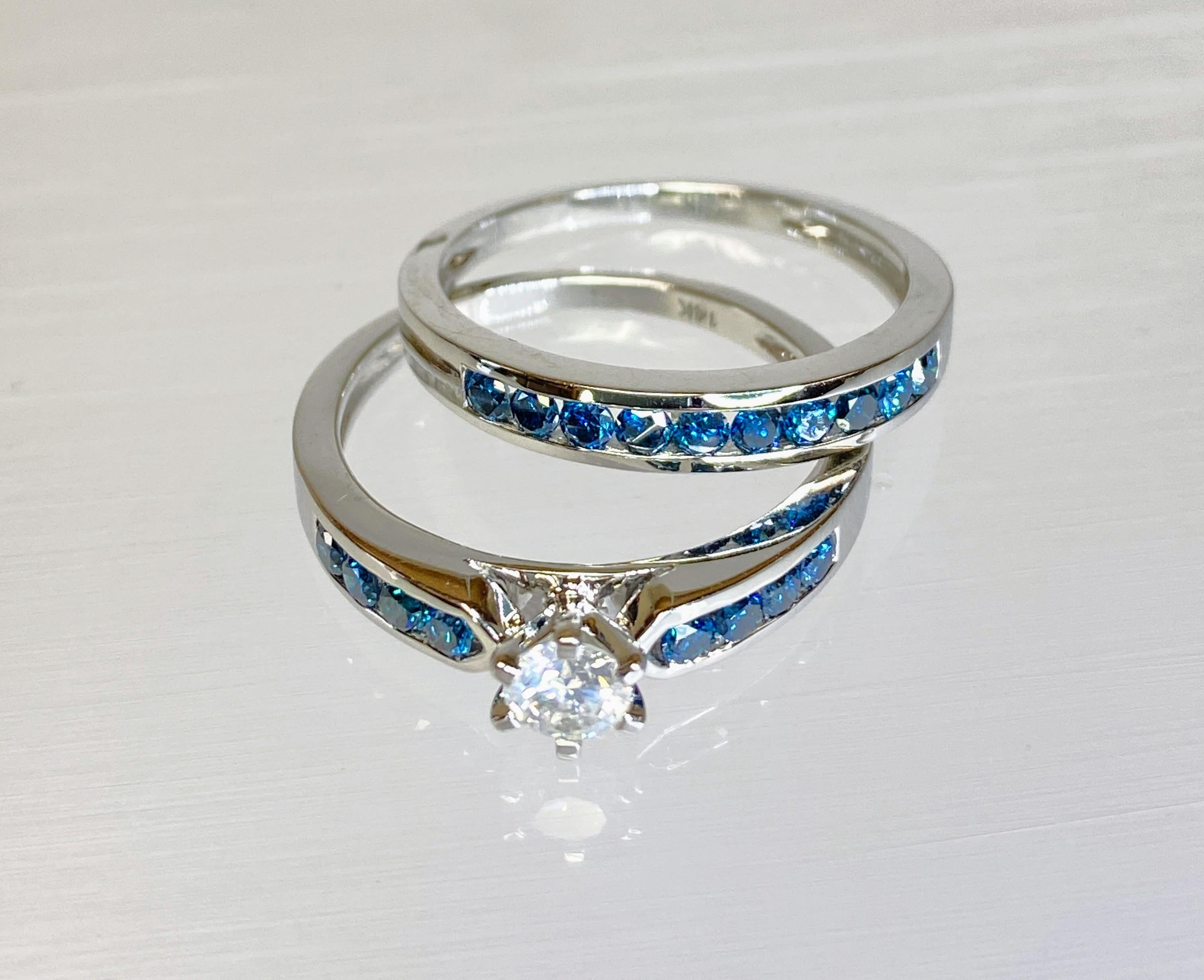 14K White Gold Blue & White Diamond Wedding/ Engagement Ring Set 5.35g

Gorgeous wedding band set. Elegant blue diamonds decorate wedding band for a simple, yet glamorous design. Engagement ring features a white diamond that is celebrated with