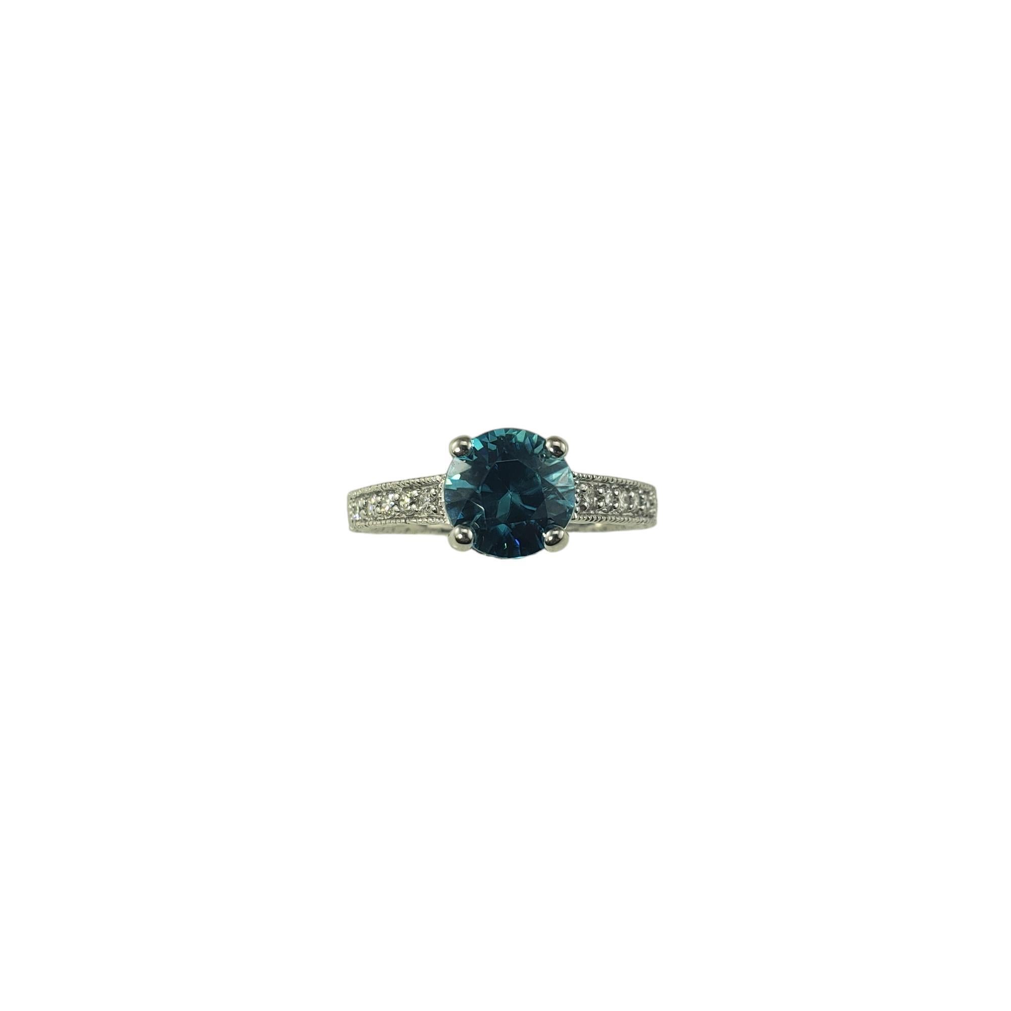 14 Karat White Gold Blue Zircon and Diamond Ring Size 8 JAGi Certified-

This lovely 14K white gold ring features one round brilliant cut blue zircon (7.8 mm) and 10 round brilliant cut diamonds in an engraved brand with milgrain edge.

Shank: 2.5