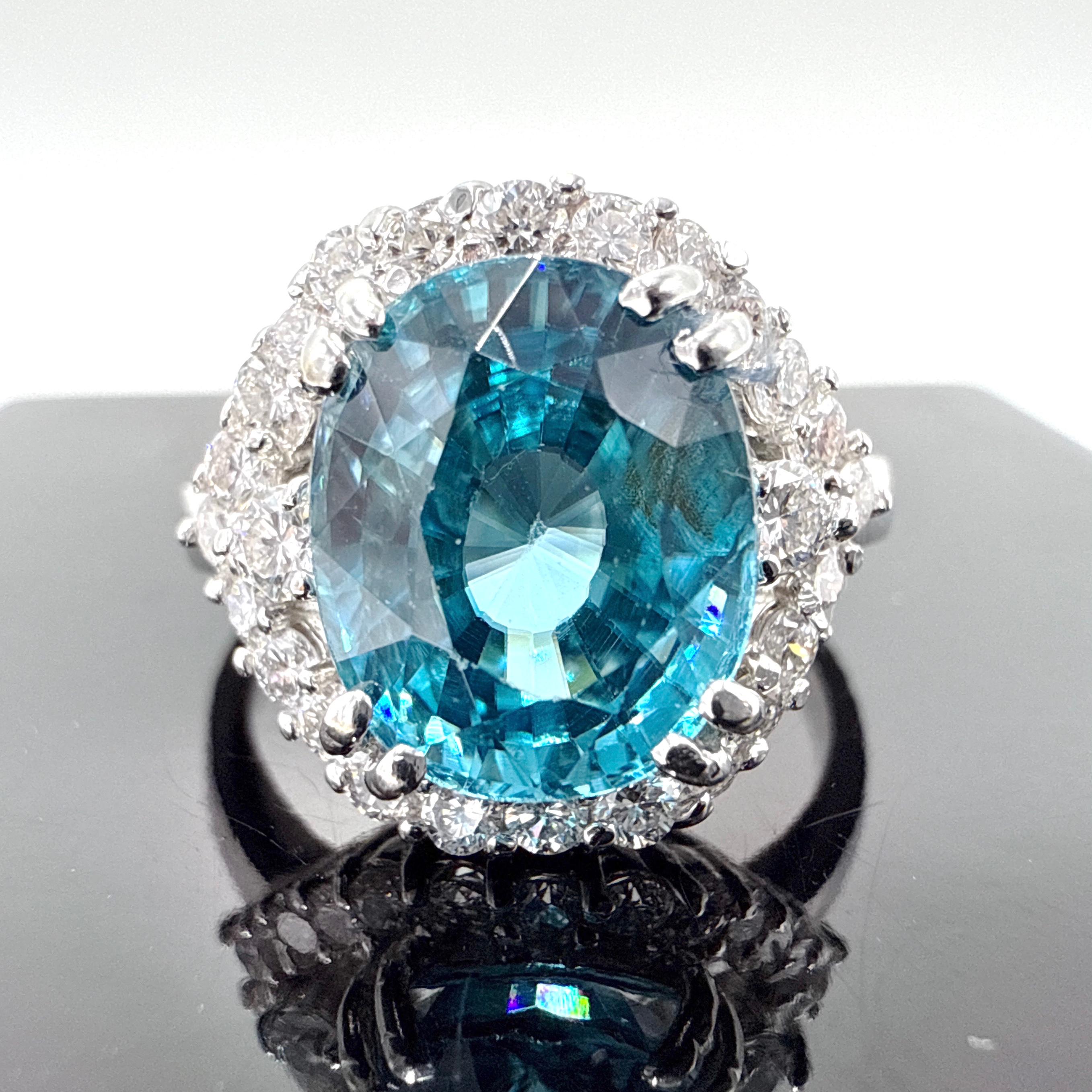 This ladies’ ring is crafted in 14K white gold and features a prominent blue zircon center stone accented by round brilliant cut diamonds. The ring is wax cast, hand-assembled, and finished with a high-polished surface and a rounded rectangular