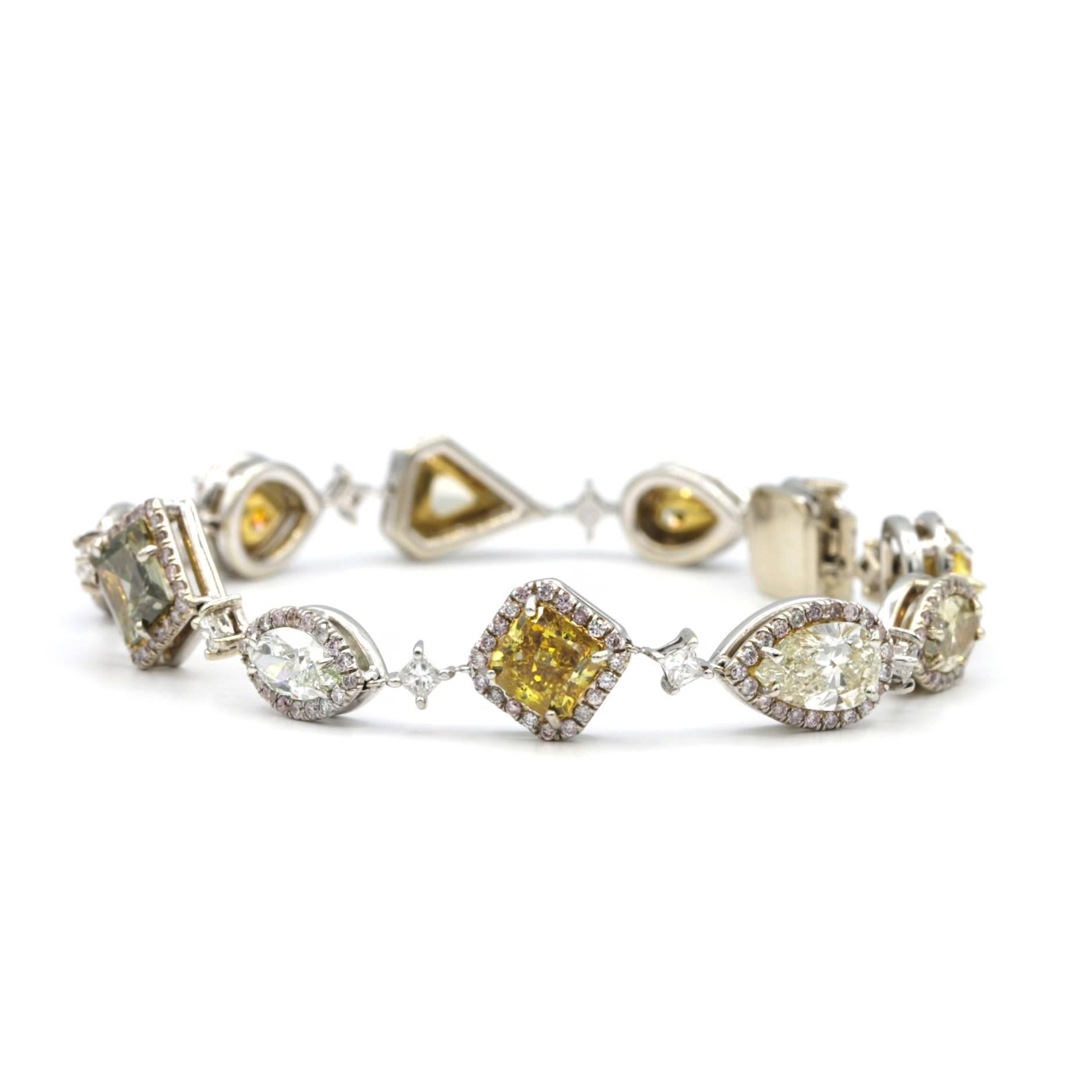 Absolutely stunning bracelet!
features 10 different fancy colored diamonds GIA certified:
Square Modified Brilliant 1.15ct Fancy Deep Brownish Orangy Yellow, 
Marquise Brilliant 0.52ct Fancy Light Yellowish Green VVS2, 
Marquise Brilliant 0.52ct