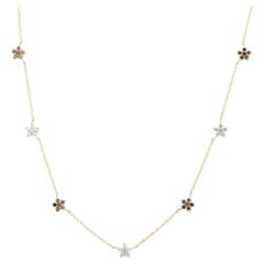 Collana con catena a fiori in oro giallo 14k con diamanti bianchi e marroni