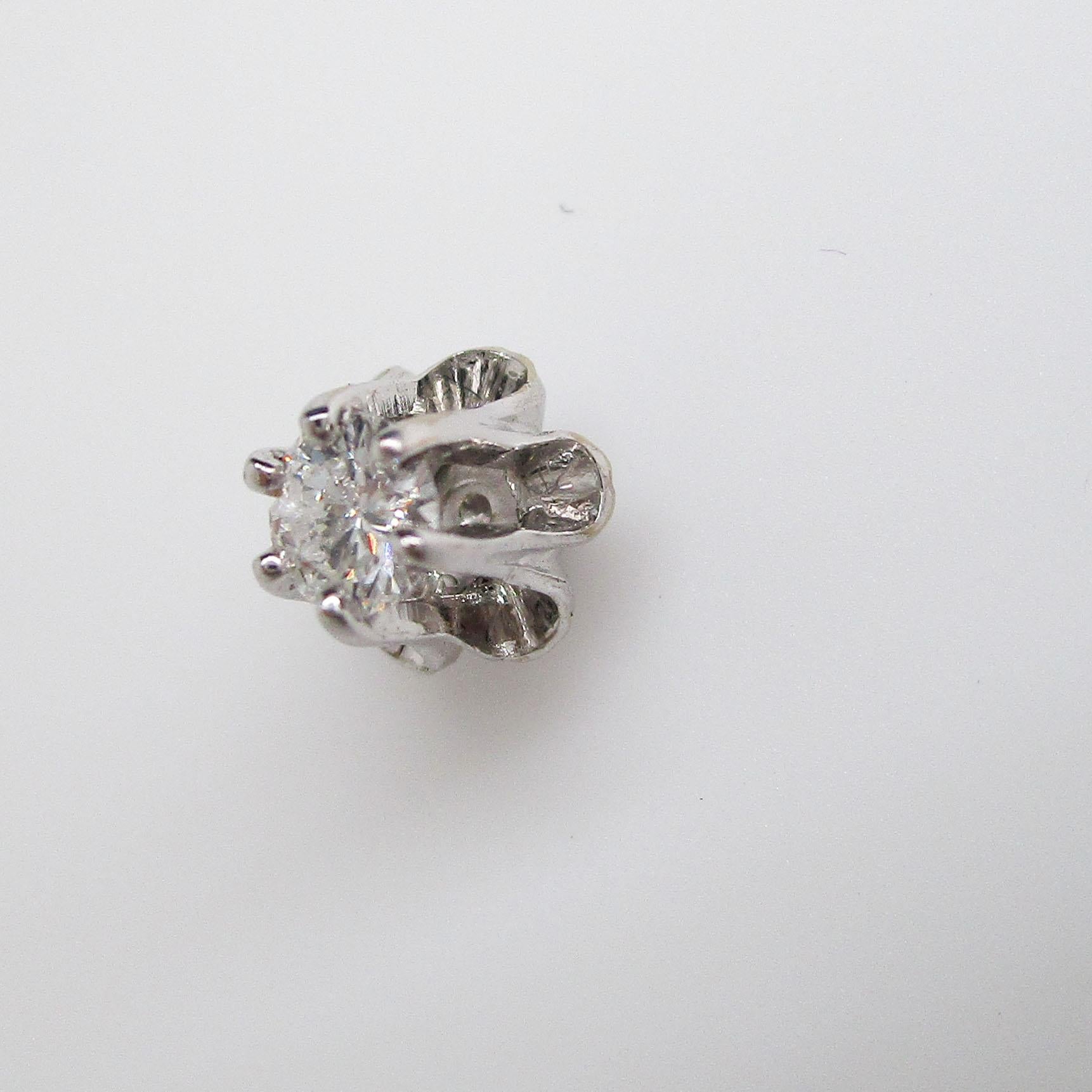 These are a lovely pair of diamond stud earrings in 14k white gold. The earrings have an elegant buttercup setting. These are the perfect everyday diamond stud earrings that every woman deserves to have in her wardrobe! These are ideal for a second