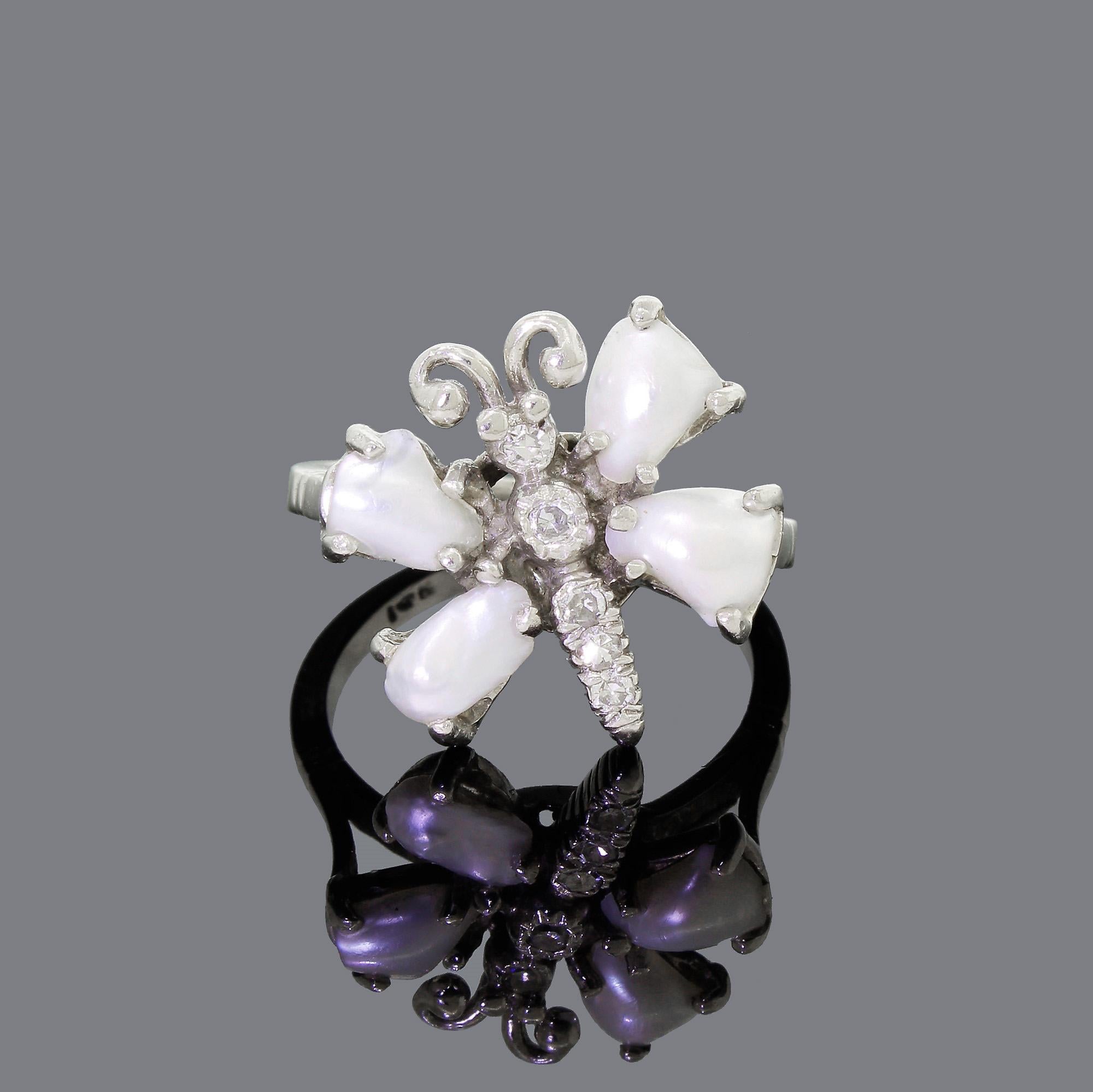 This lovely estate-found ring is incredibly elegant in person. The ring maintains a classy aesthetic while showing off the fun side to your nature.
The pictures simply do not do it justice. Set at a slight angle, the butterfly looks like it is just