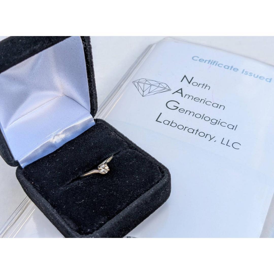 Vintage
Size: 5.5
Materials: Gold
Gemstone: Diamond
Gem Color: Colorless

Band Color: White

Beautiful engagement ring.

14k Polished White Gold. Weighted at 1.7grams total. It is cast and assembled.

Diamond is at 0.20ctw. It is rated at VS1