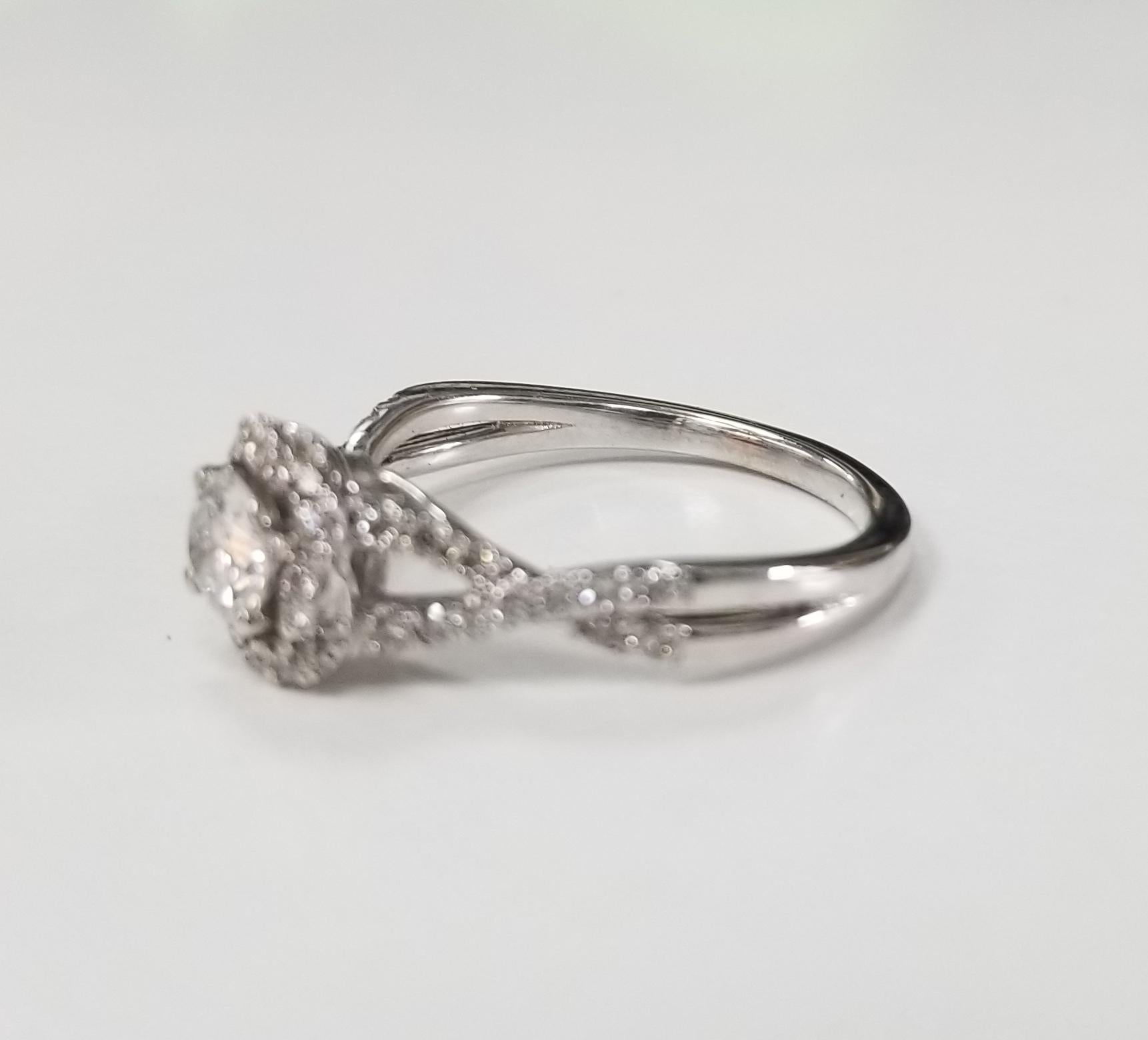 14k white gold bypass diamond ring, containing 1 brilliant cut diamond; color 