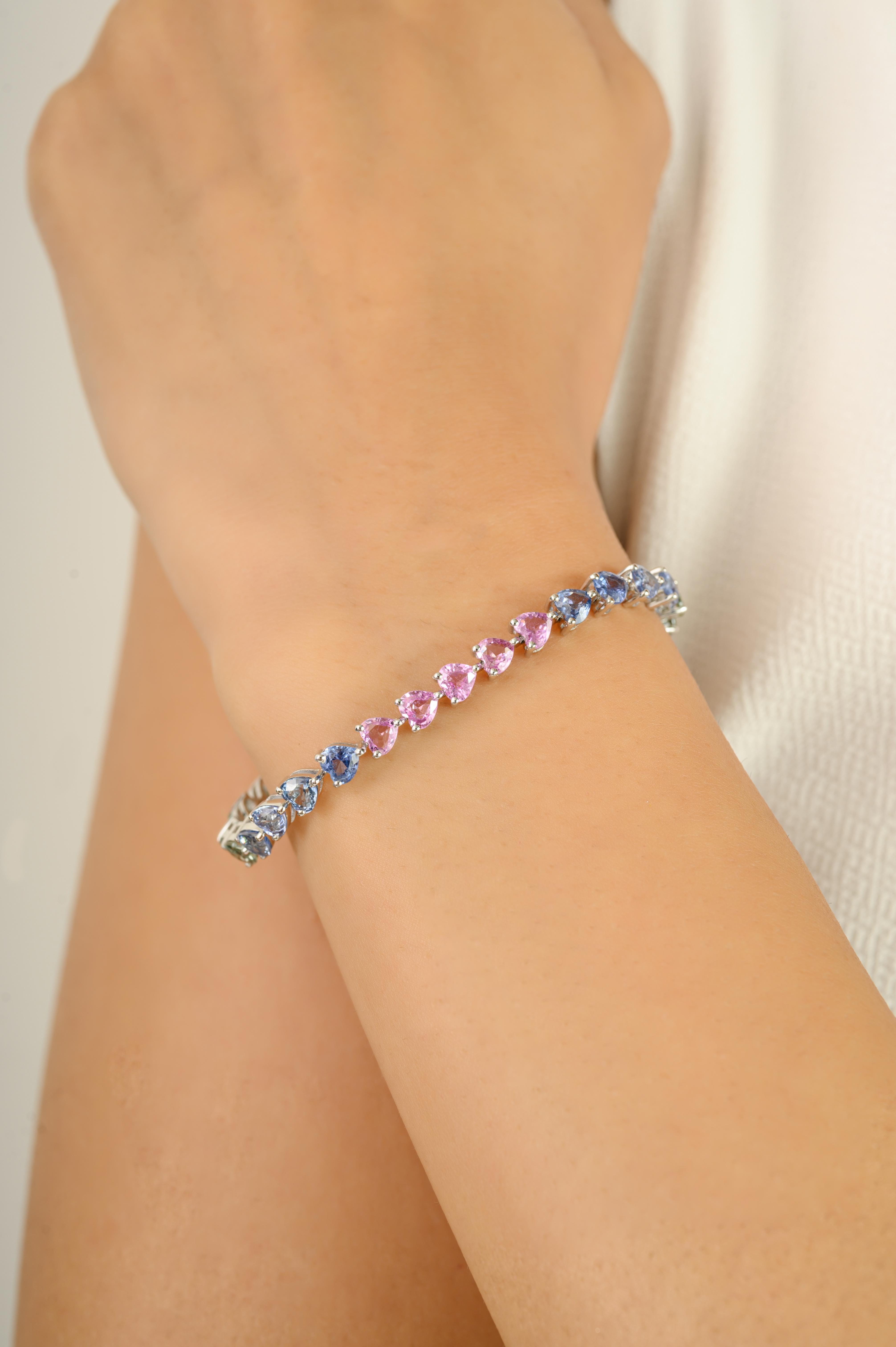 Celebrate color, elegance, and timeless craftsmanship with this exquisite tennis bracelet in 14k white gold. Featuring an impressive 11.33 carats of heart-shaped multi sapphires, each stone is meticulously set to create a harmonious rainbow gradient