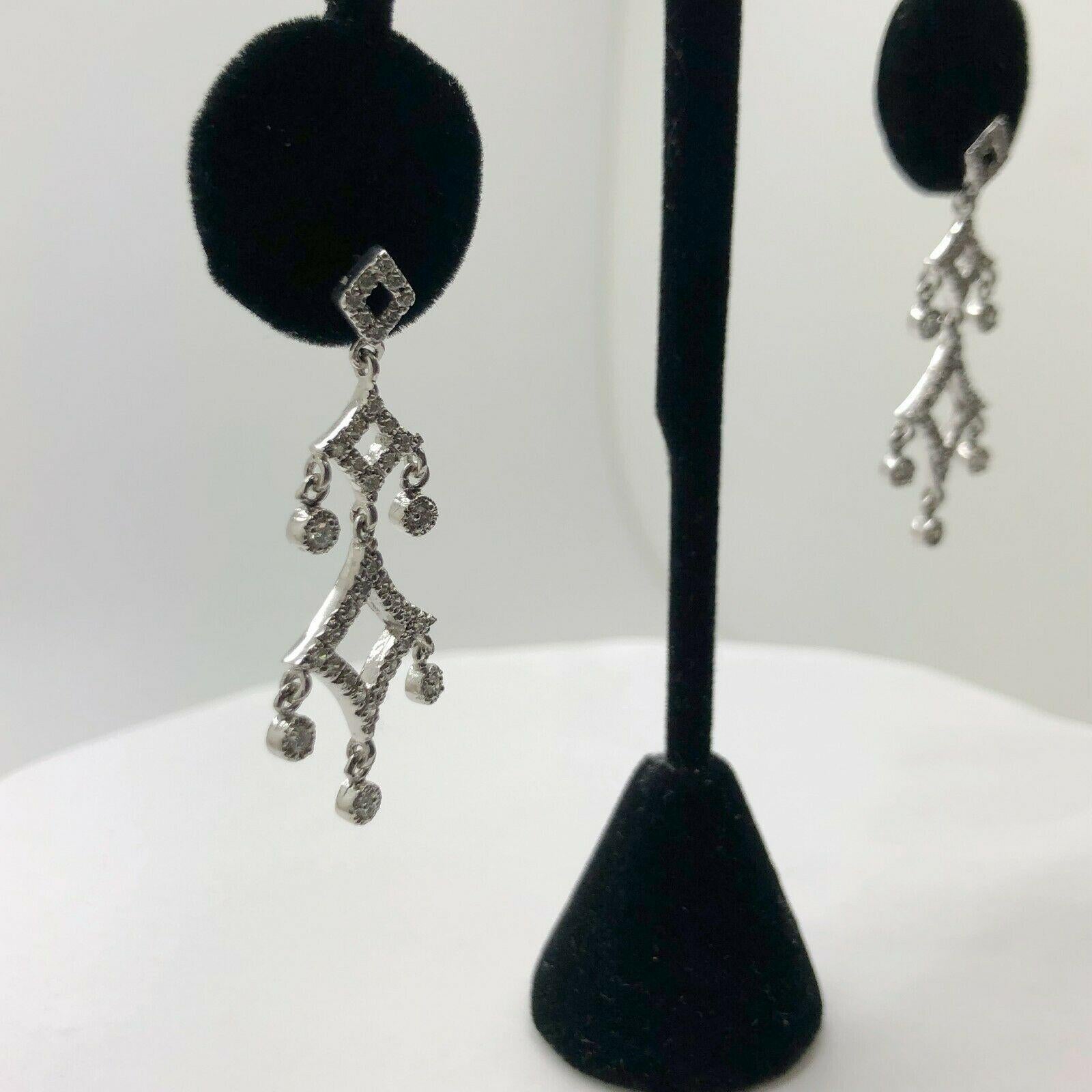 Discover diamond decadence with these dramatic chandelier earrings. at 4cm in length with over 1.04 carat of round brilliant diamonds with a color of F and has a clarity of SI2 set in gleaming 14k white gold, they are a bridal or special occasion