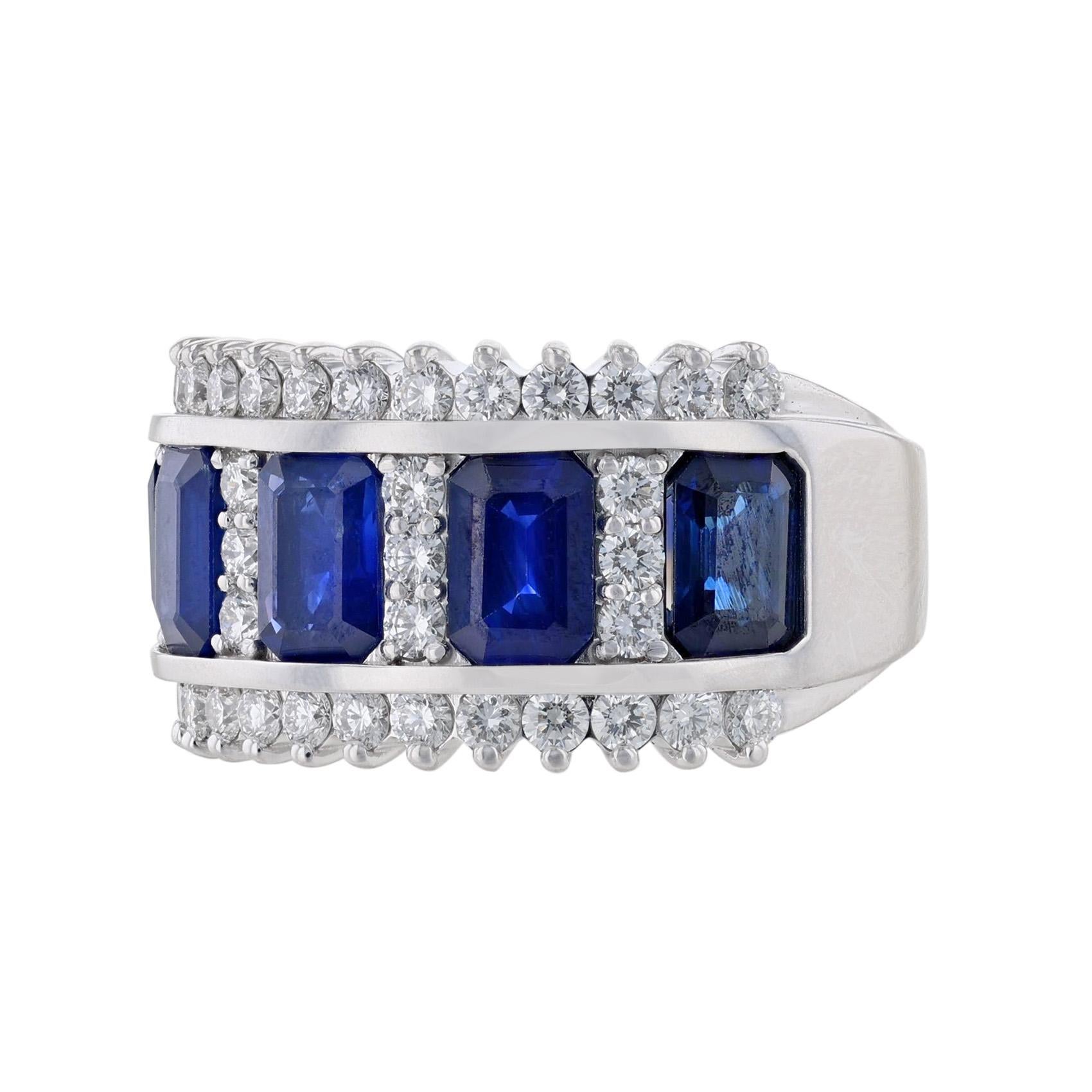 This ladies ring is made in 14k white gold. It features 5 emerald cut, channel set blue sapphires (H) weighing 3.43 carats. Surrounded by 40 round cut, prong set diamonds weighing 1.01 carats. With a color grade (G) and a clarity grade of (VS2).